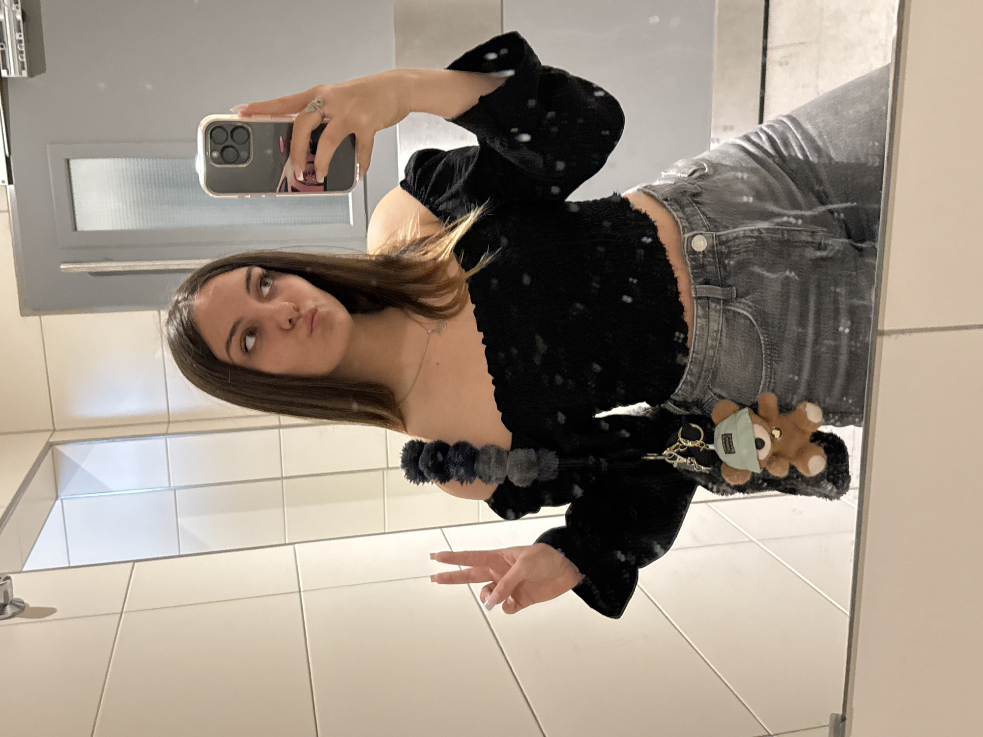 Woman takes mirror selfie in Sofia public facility