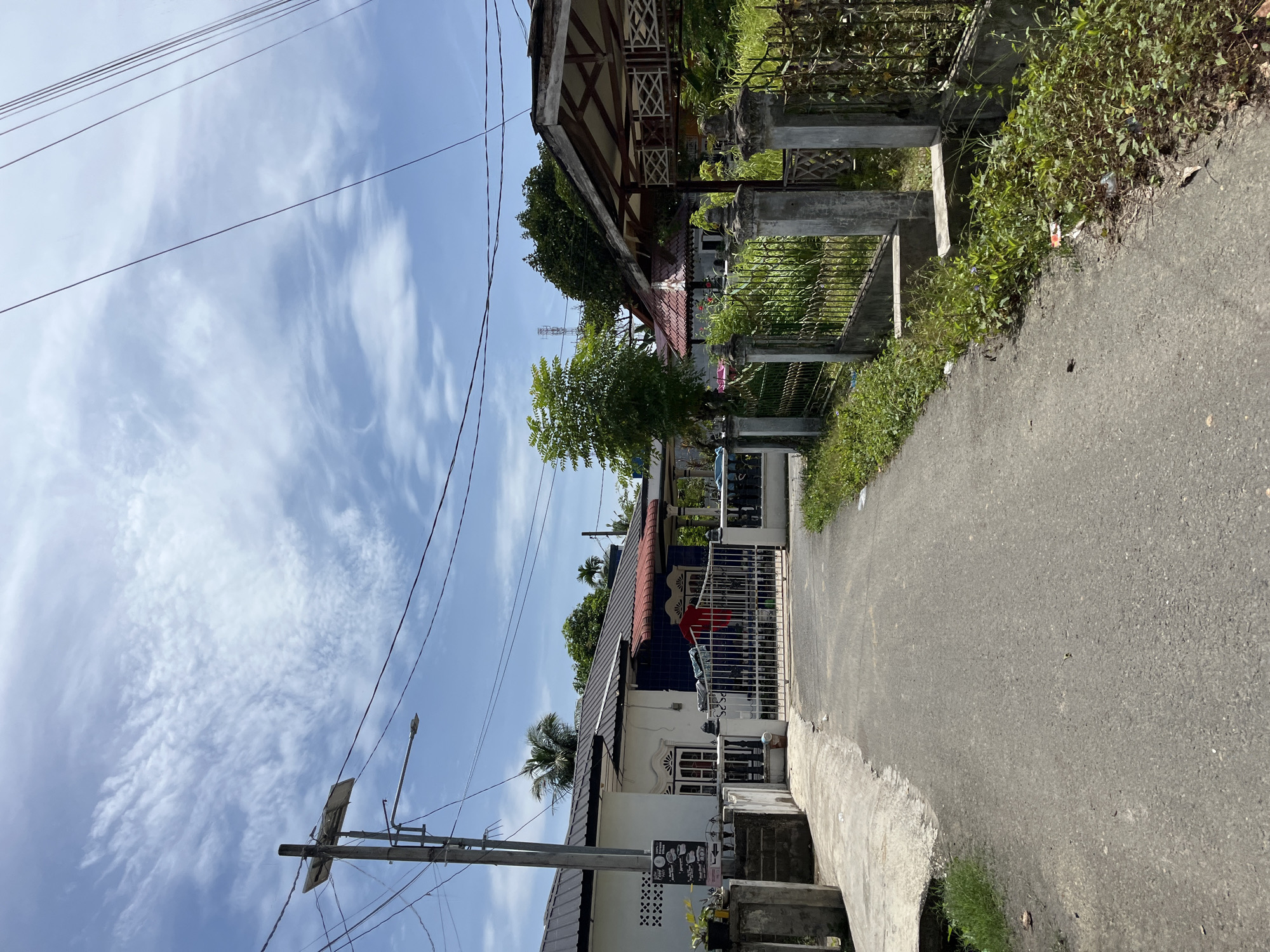 Cruising through Langsa's quiet residential streets on a sunny morning