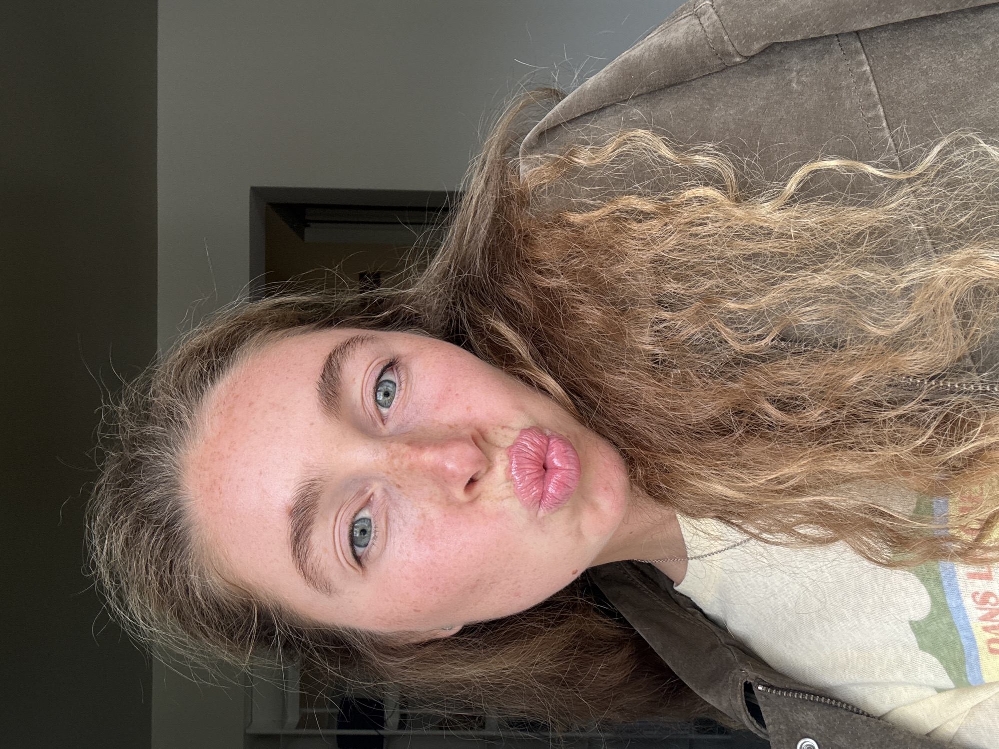 Woman takes selfies in Madrid residential setting