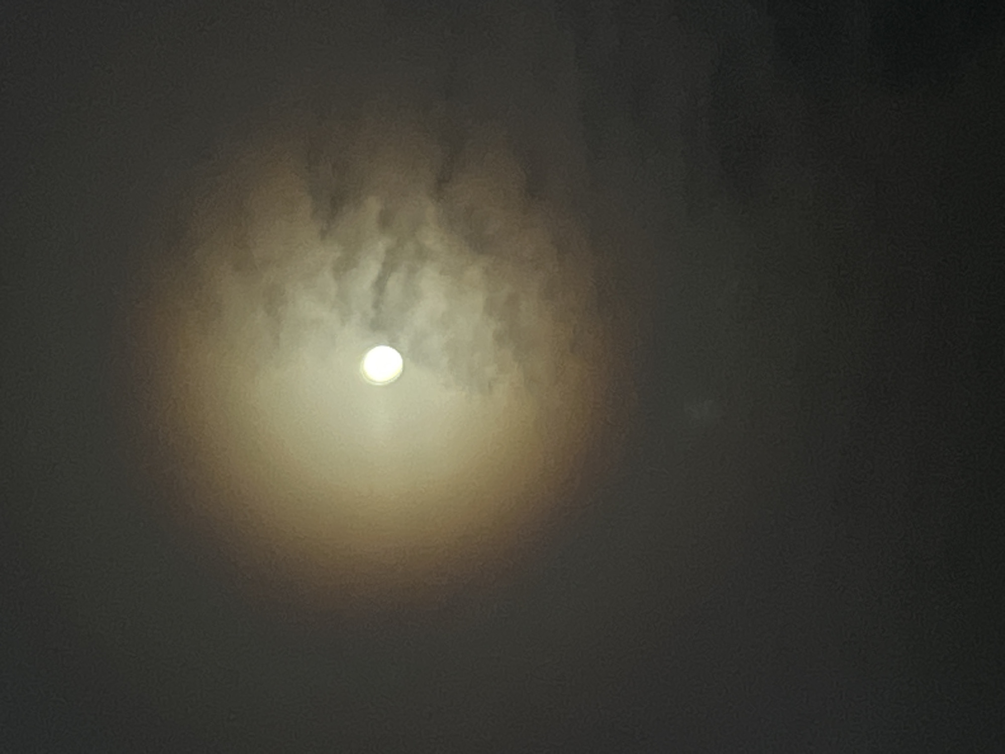 Moon observed through clouds over Pchelnik, Bulgaria