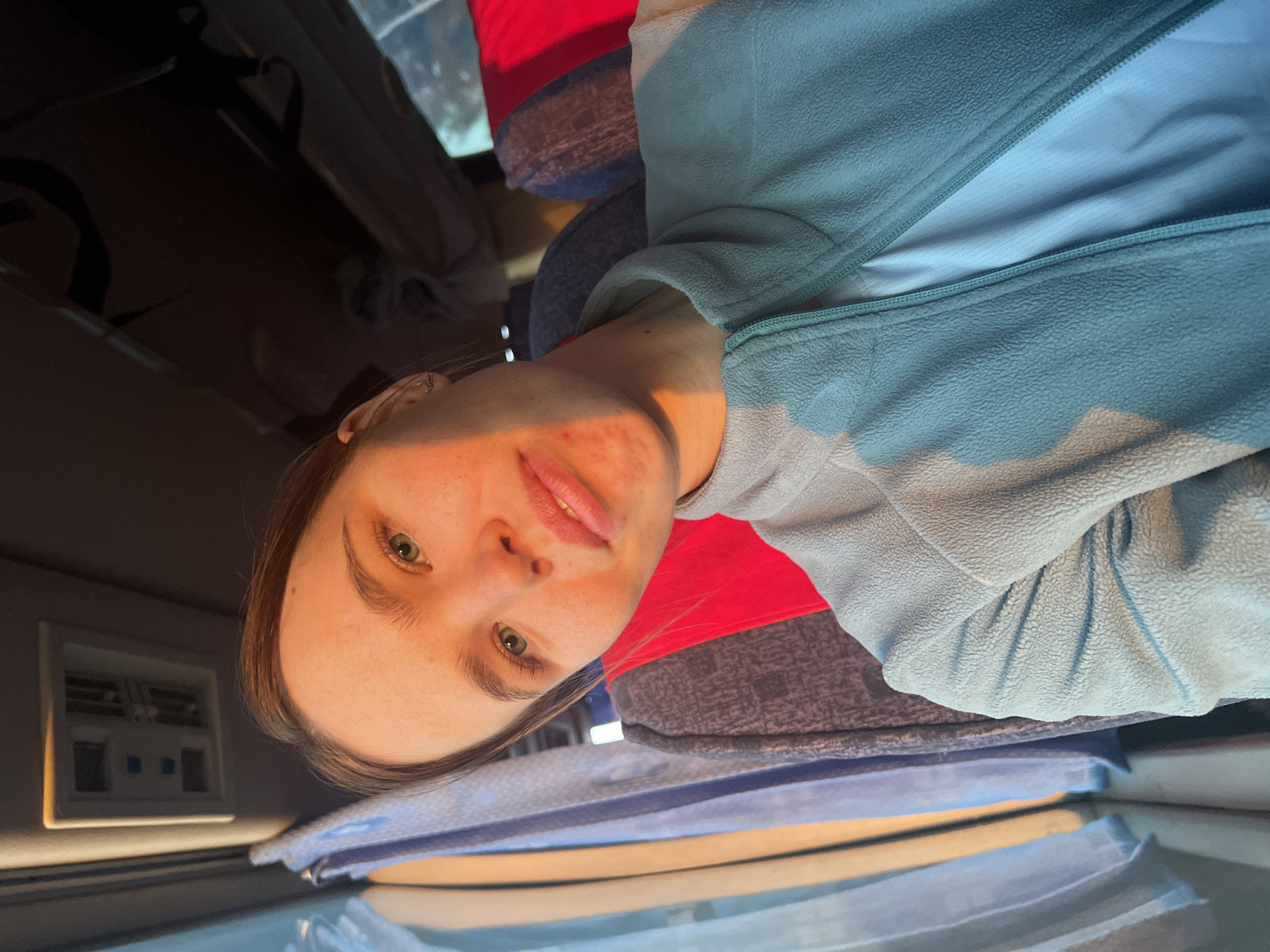 Woman takes selfies in vehicle interior in Ustinovo, Russia