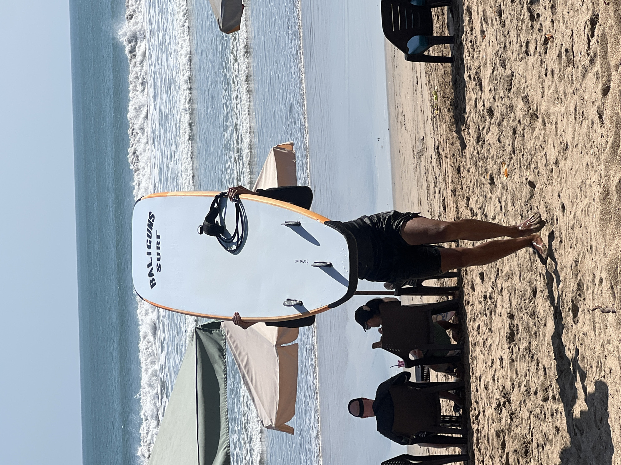 Kuta Beach morning: surfboards, ocean views, and beachside braiding