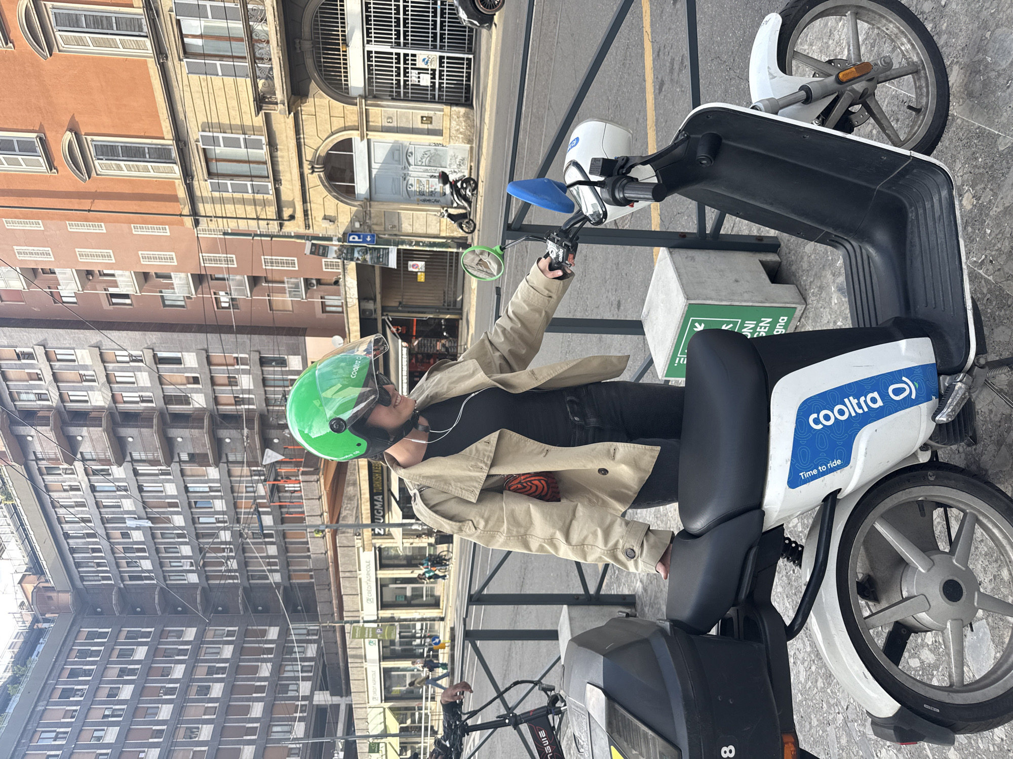 Cooltra scooter rider spotted in Milan wearing lime helmet