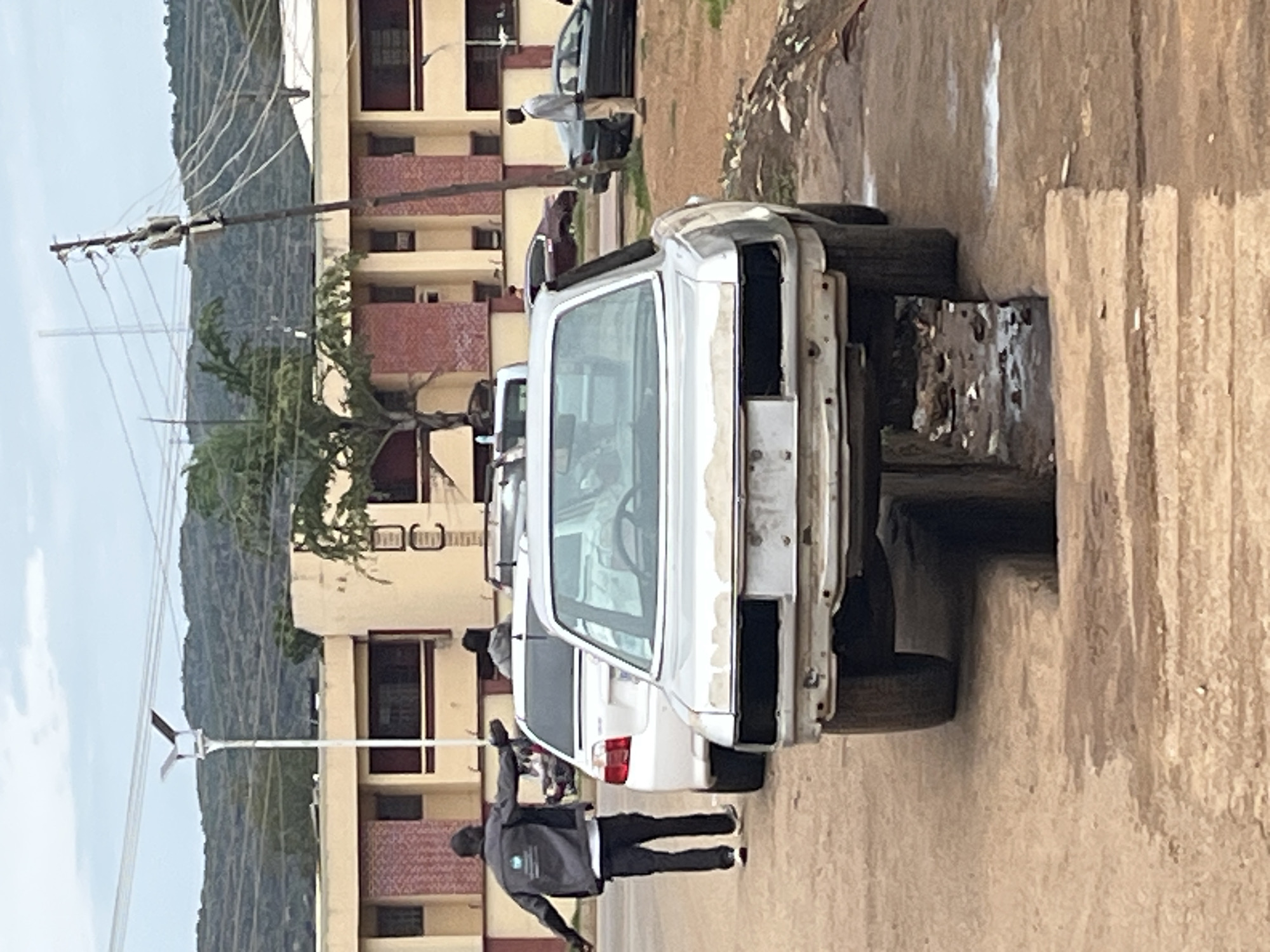 Street life and vehicle scenes across two Nigerian neighborhoods