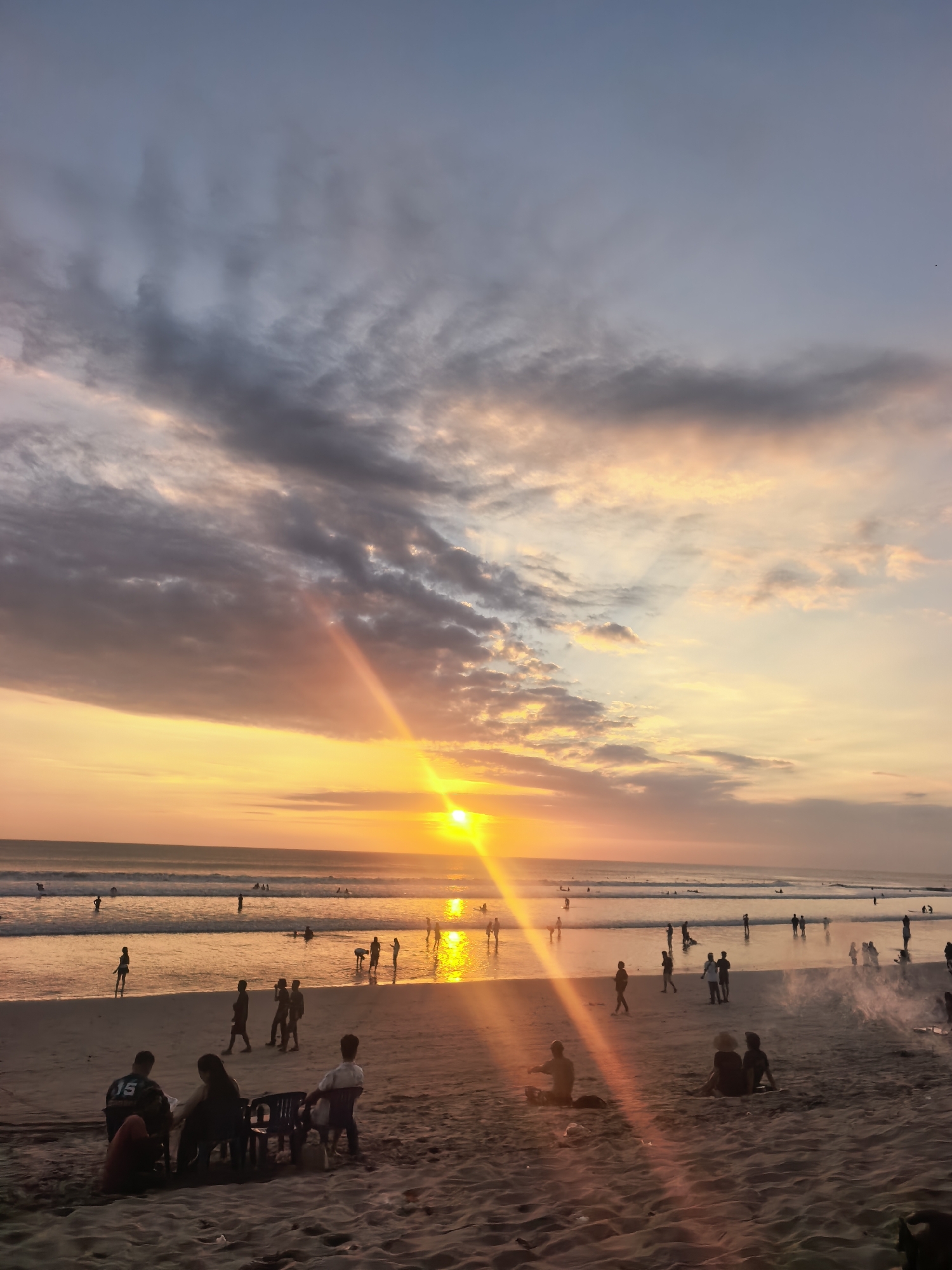 Kuta Beach sunset draws a crowd, capped with fireworks