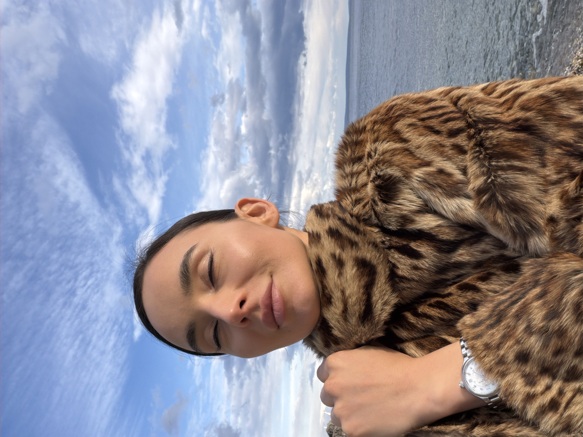 Woman poses for photo near water in Opatija, Croatia