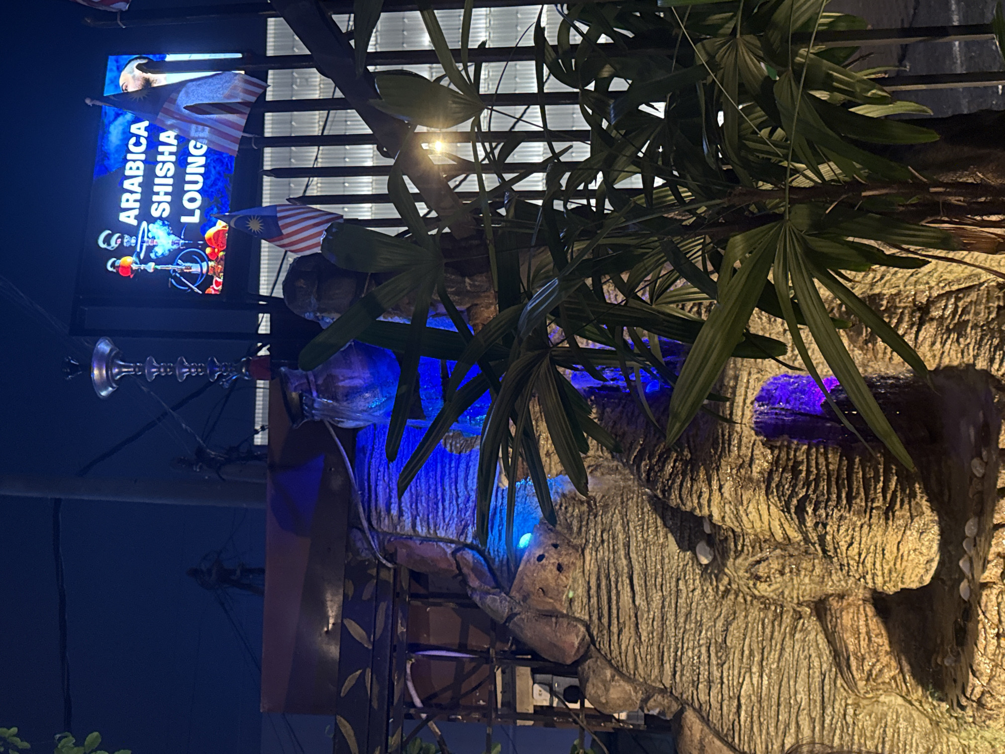 Nighttime documentation of Arabica Shisha Lounge exterior in Kuala Lumpur