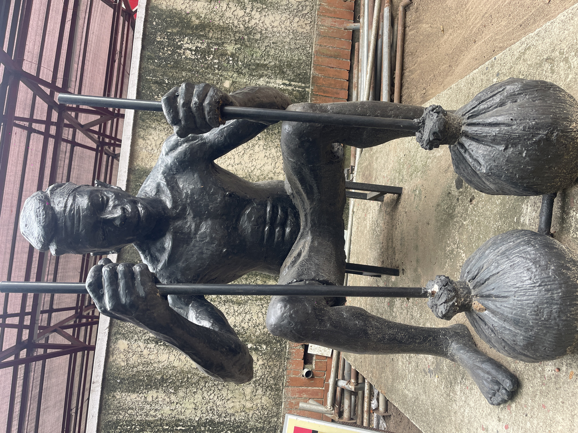 Bronze statues of seated figures documented at single location
