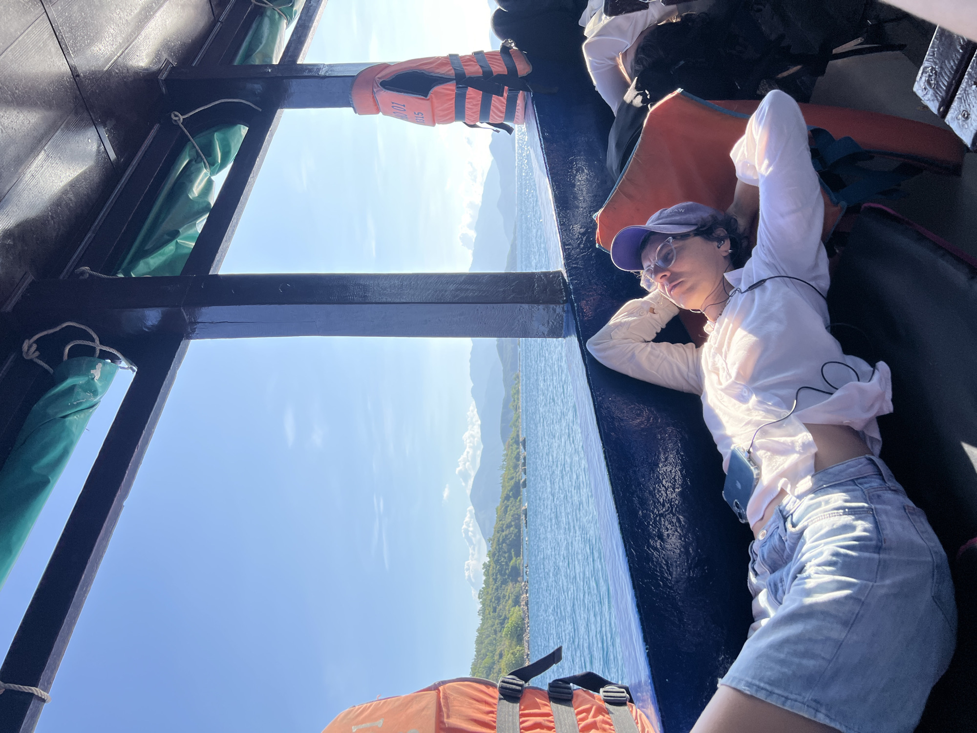 Woman rests on boat in Nha Trang waters