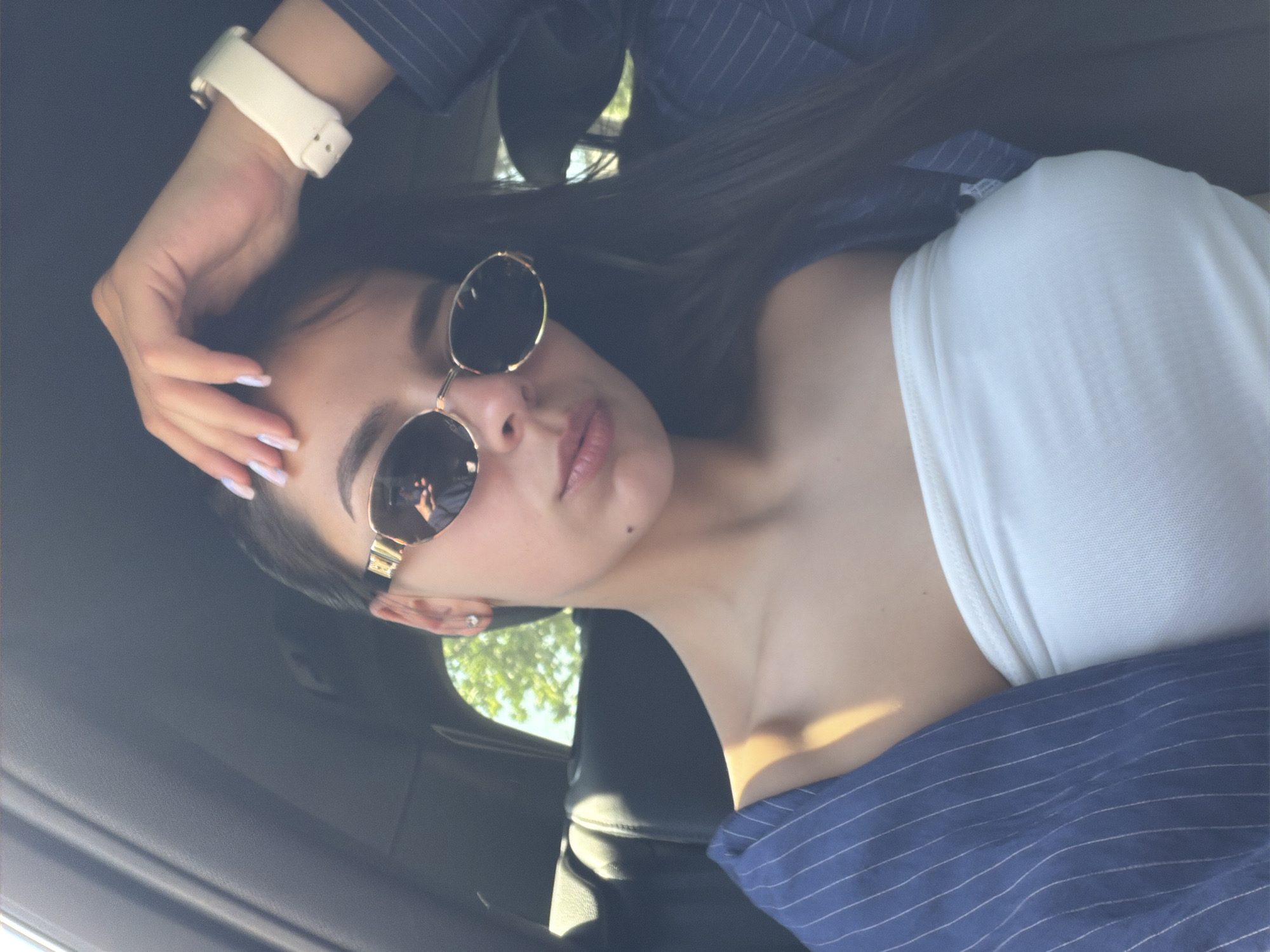 Woman in sunglasses photographed in car, Ruse Bulgaria