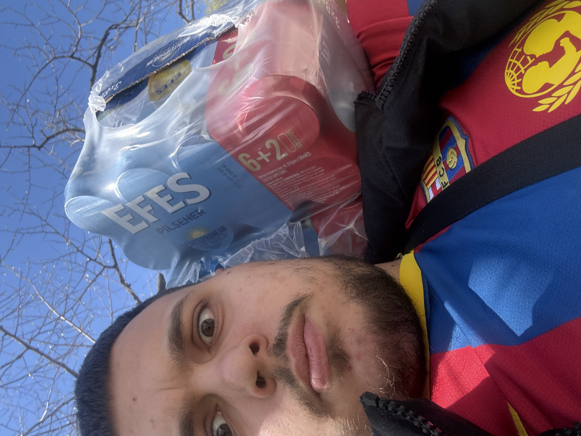 Man lies outdoors under blue sky in Plovdiv