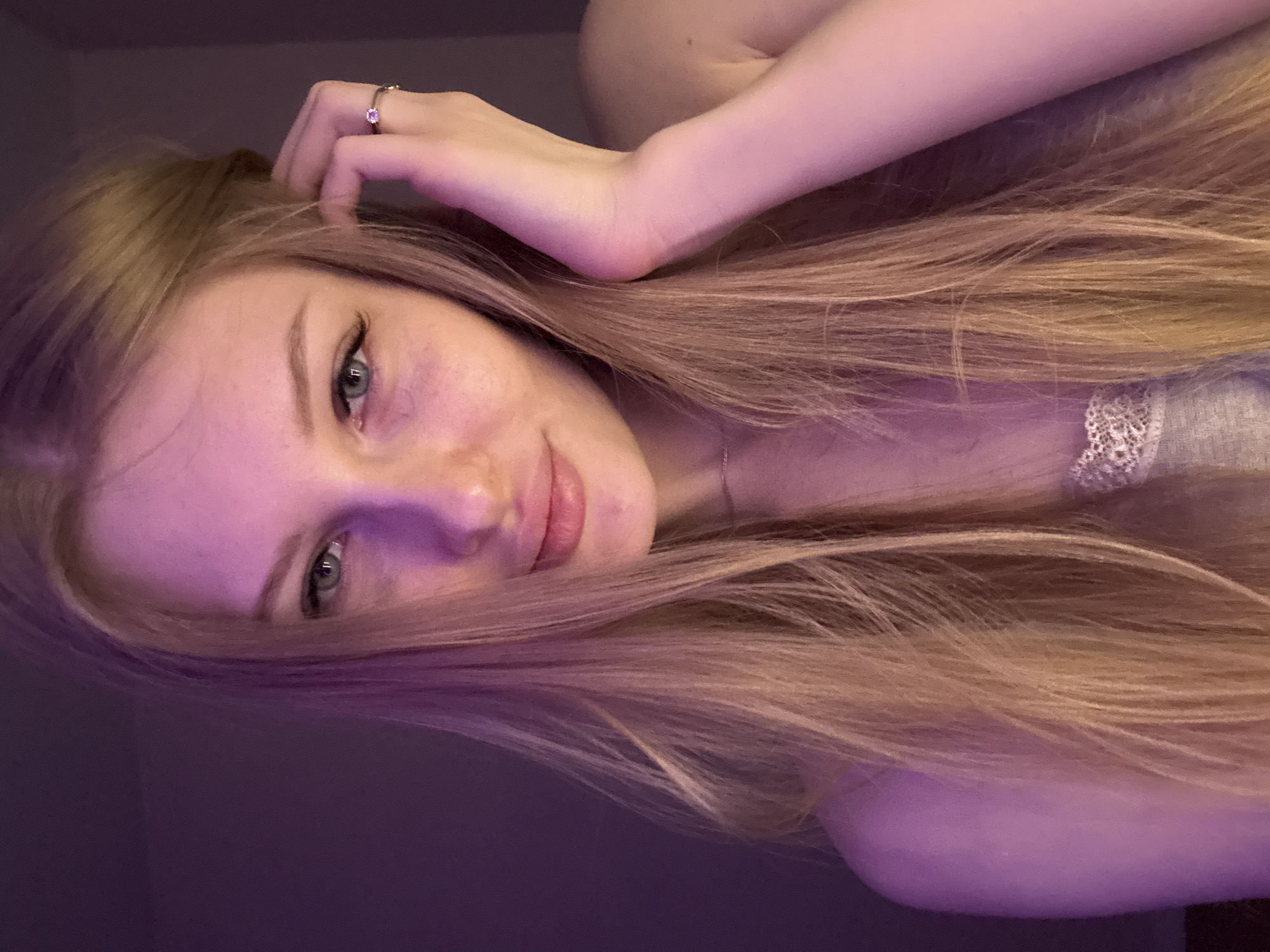 Portrait photos taken under purple lighting in Perm