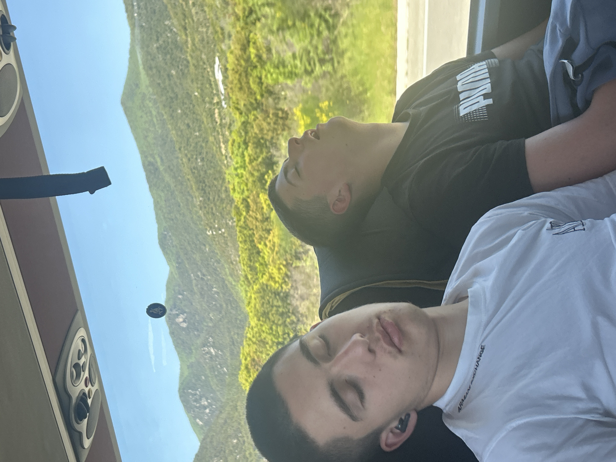 Passengers sleep on bus journey through Vrasna, Greece