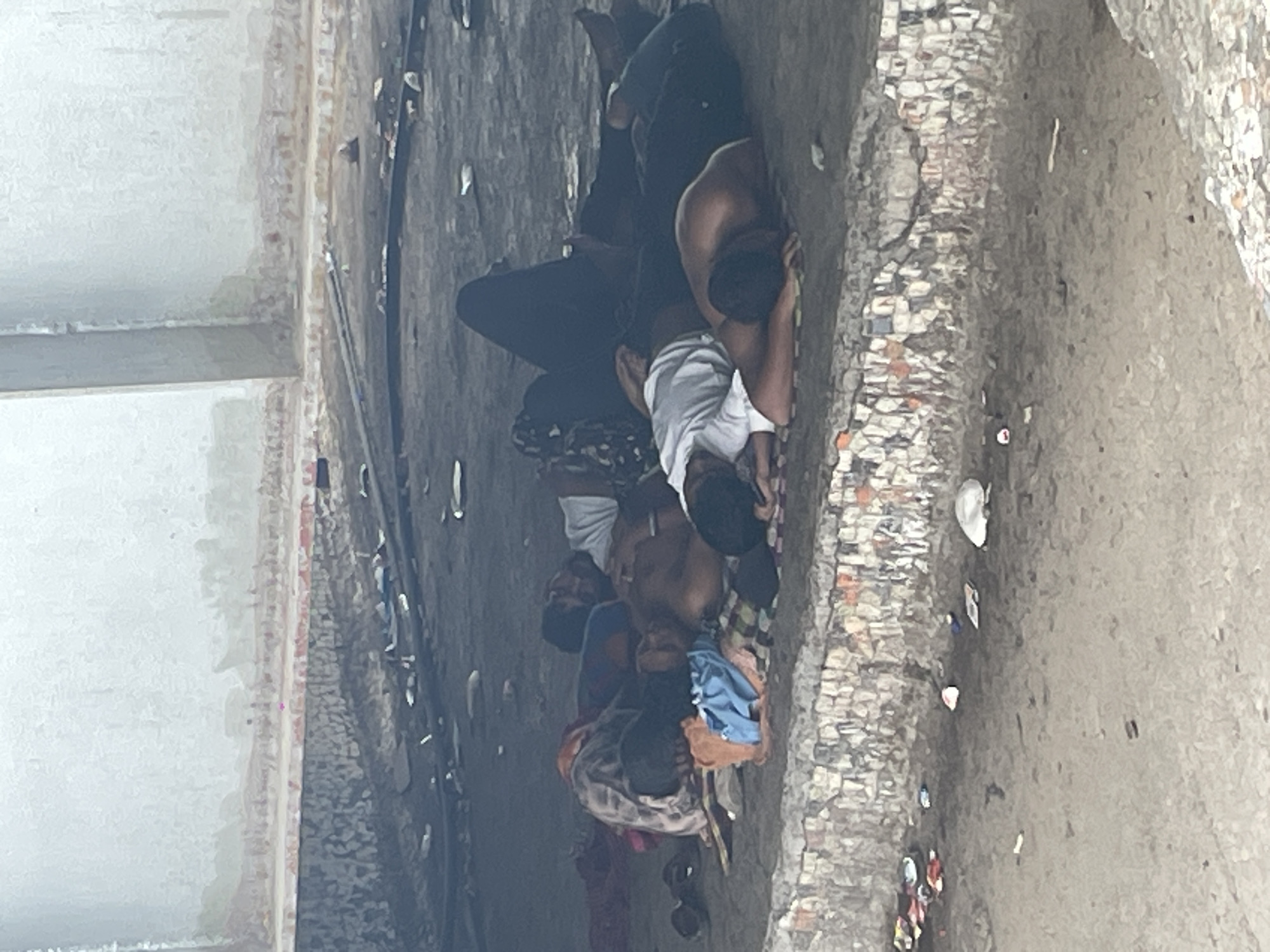 People sleeping rough under Mumbai elevated structure