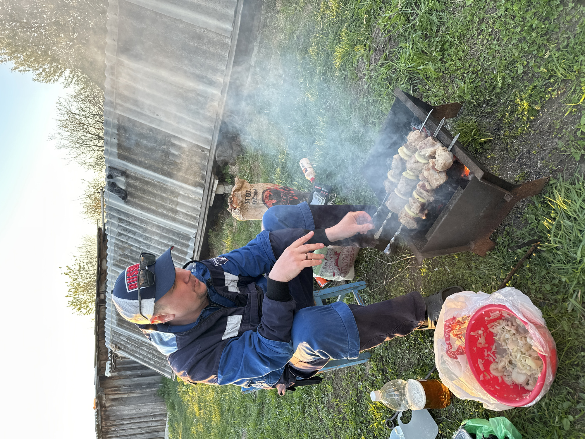 Family barbecue gathering documented in rural Russian village