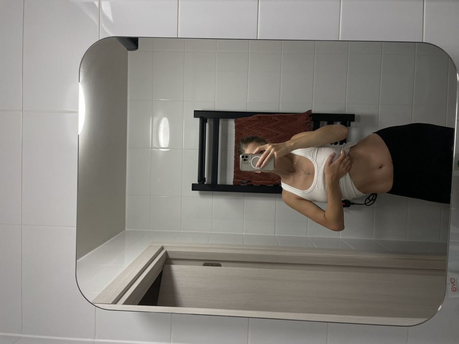 Woman takes mirror selfies in Khimki apartment