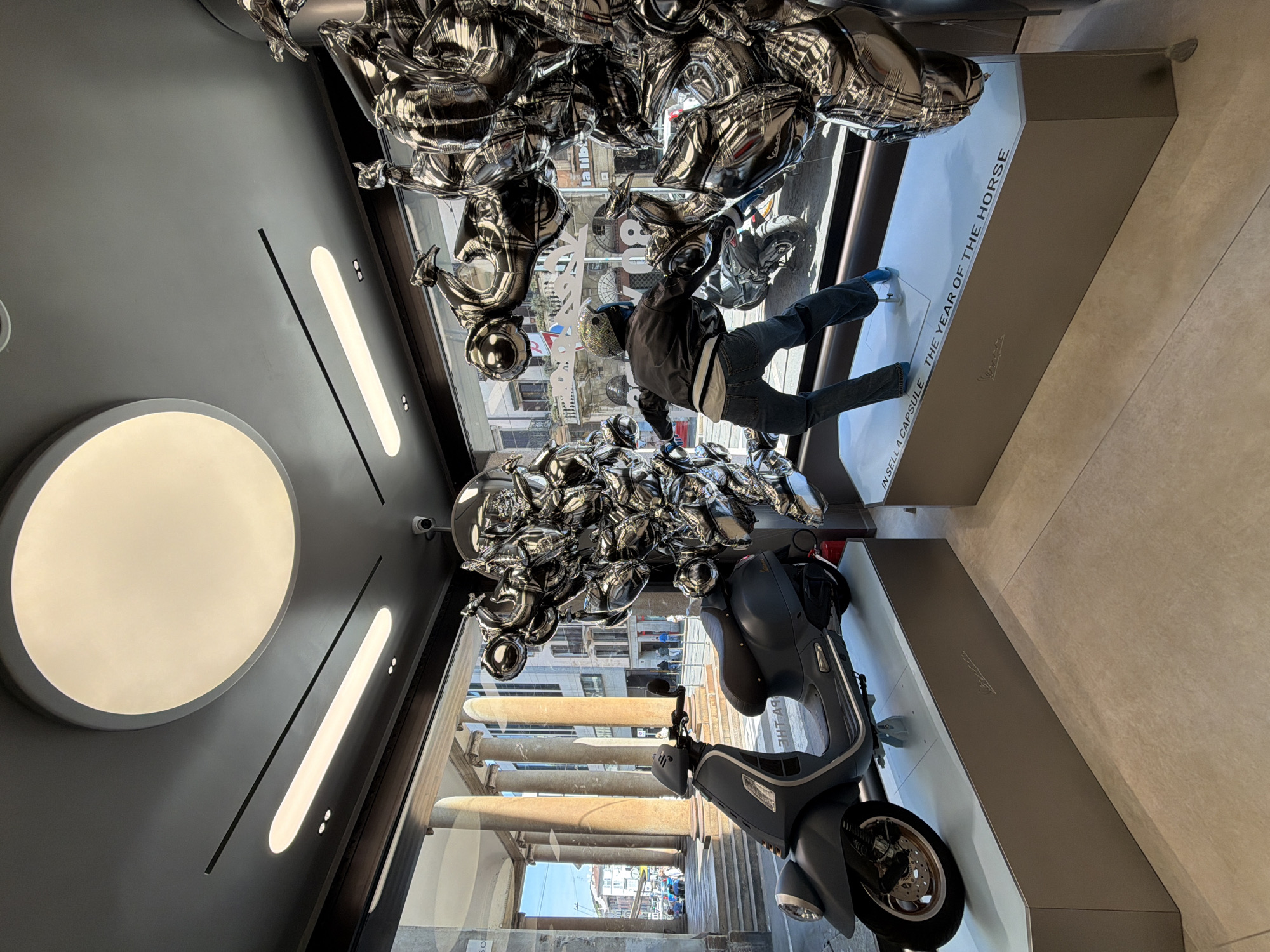 Vespa store display and tradition hashtag documented
