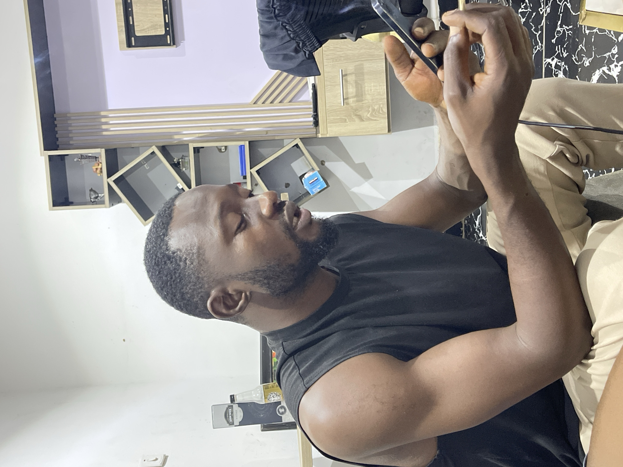 Casual indoor hangout in a residential Abuja setting