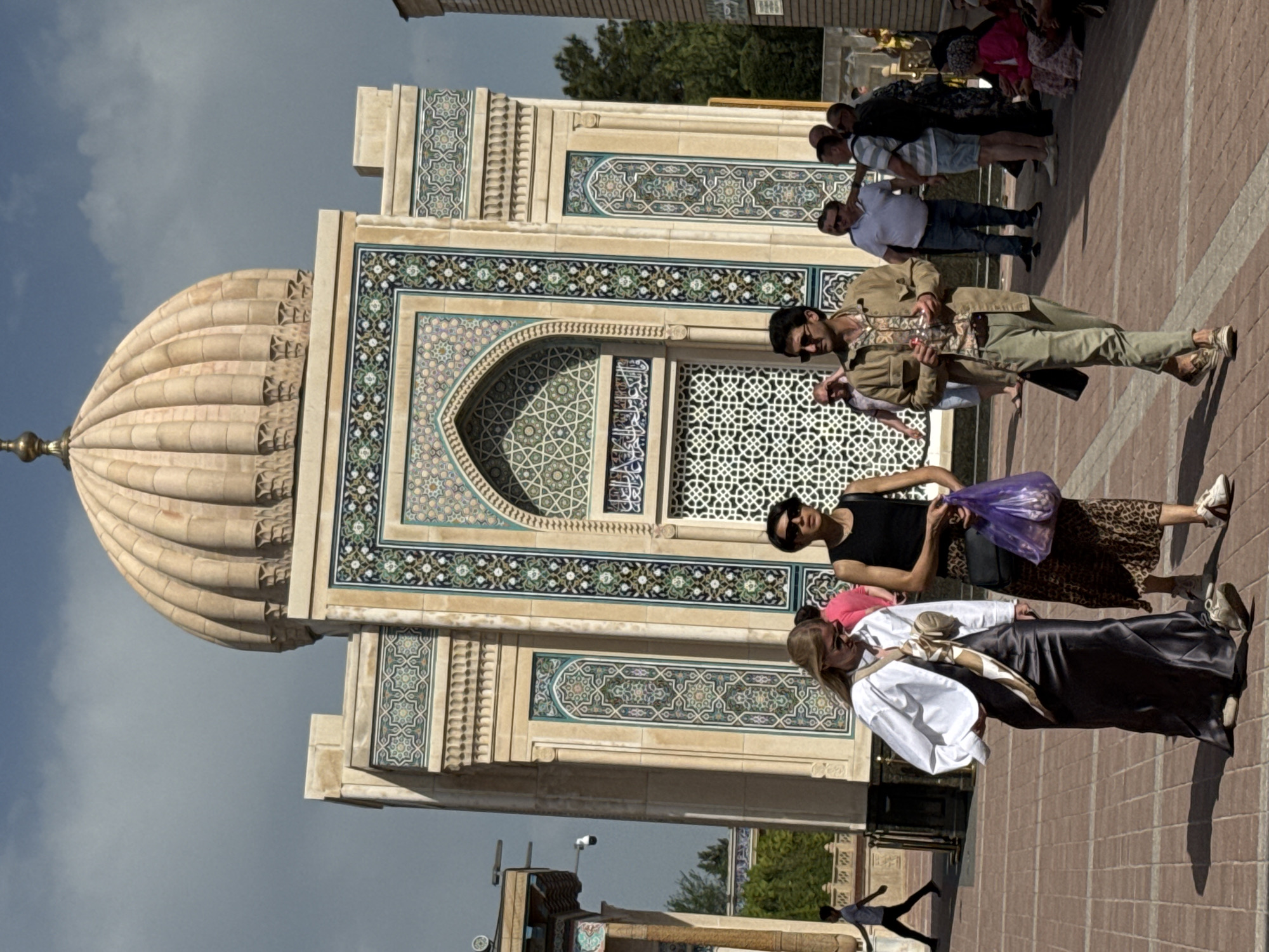 Tourist documents historic Islamic architecture in Samarkand, Uzbekistan