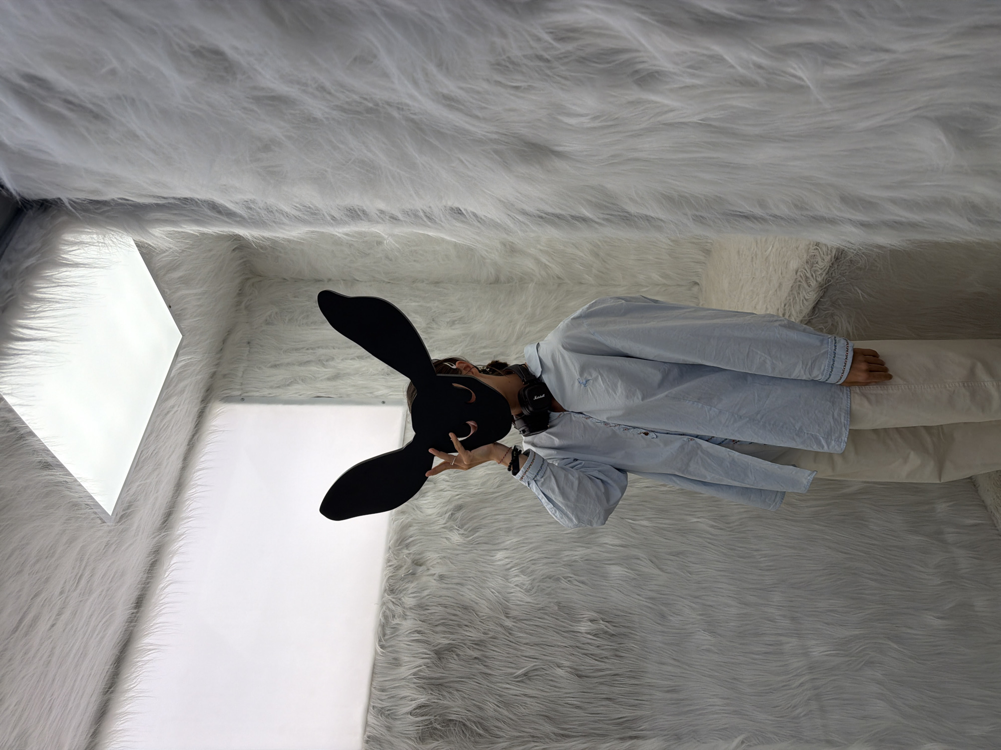 Visitors explore white fur installation in Saint Petersburg