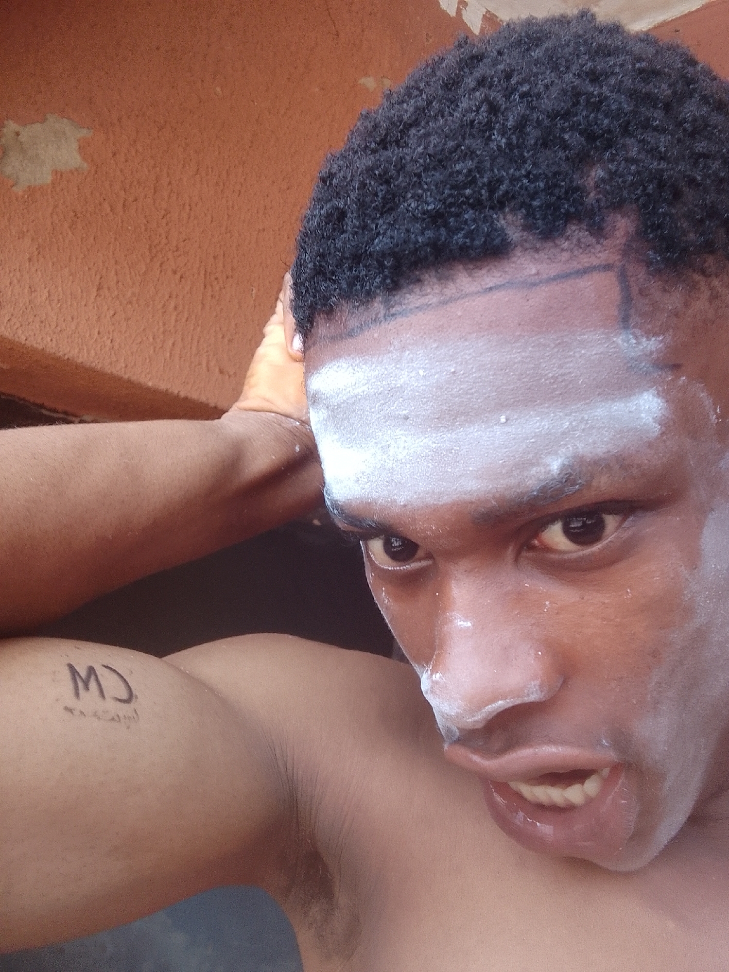 Man documents paint application process in Nkpor, Nigeria