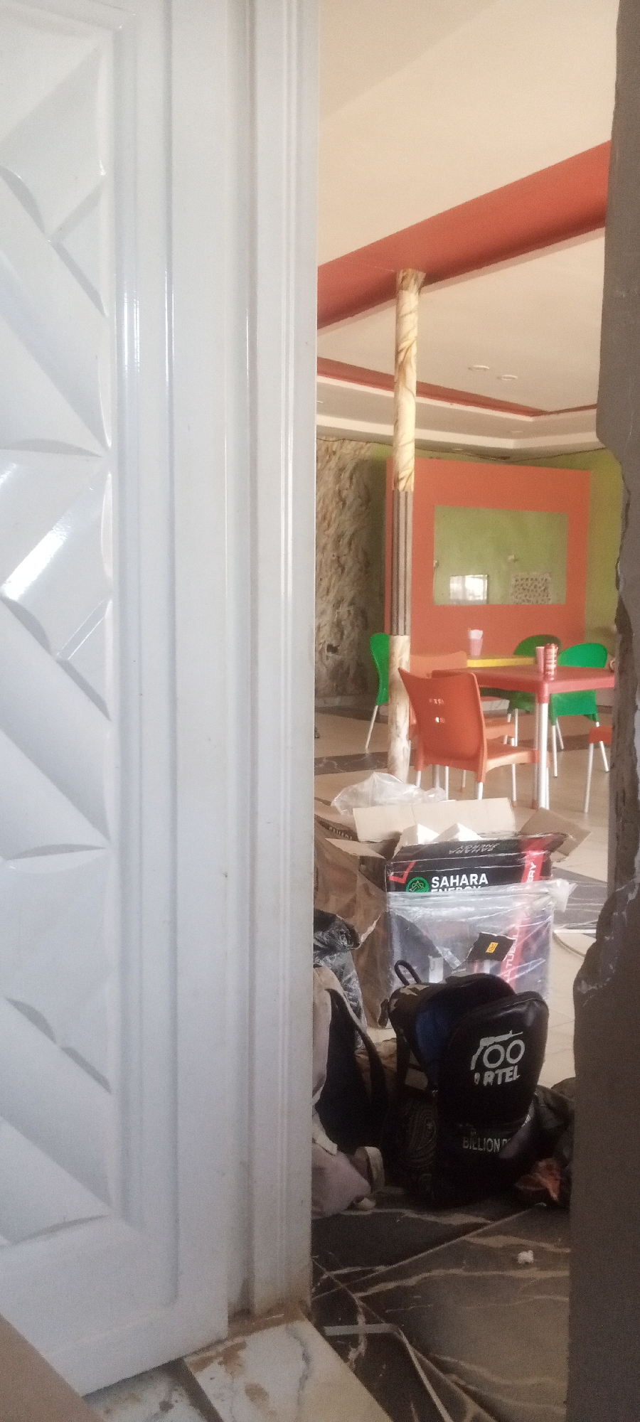 Dining area glimpsed through doorway in Sabon Gari Nassarawa