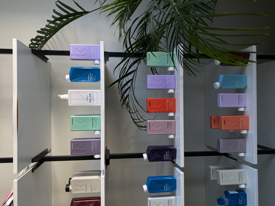 Colorful shampoo bottles documented on store shelves in Ust-Ilimsk
