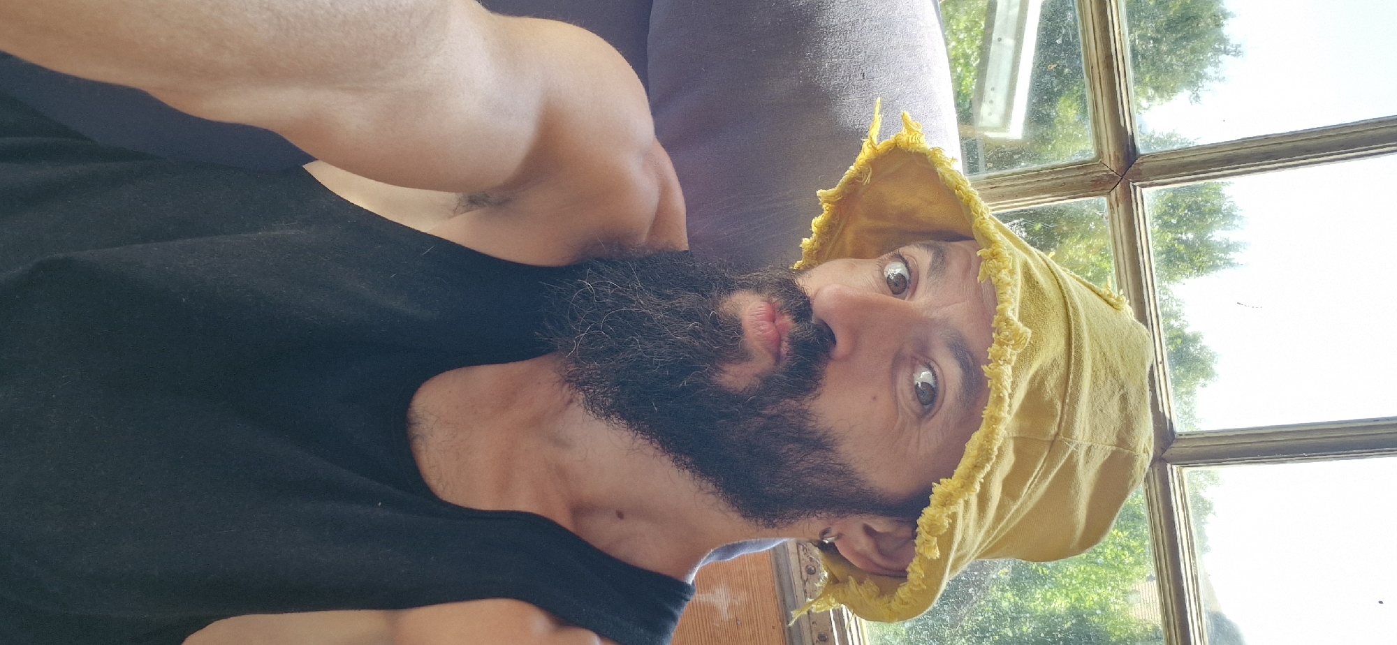 Yellow bucket hat selfie session in sunny Wattenwil, Switzerland