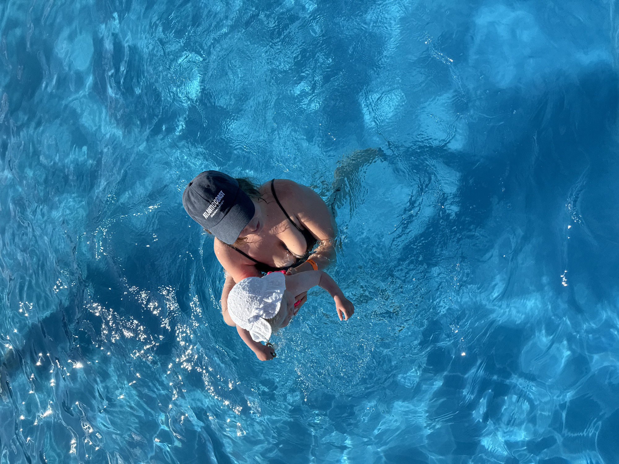 Family pool day with infant in Koloksha, Russia