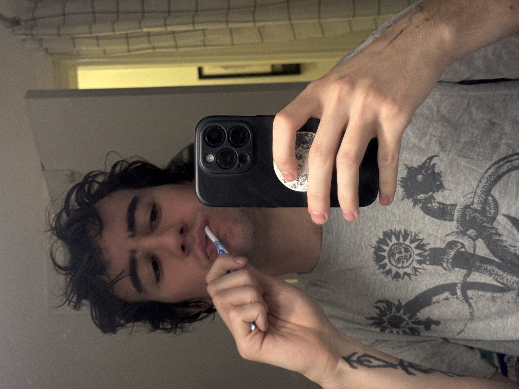 Man takes multiple selfies in Paris apartment