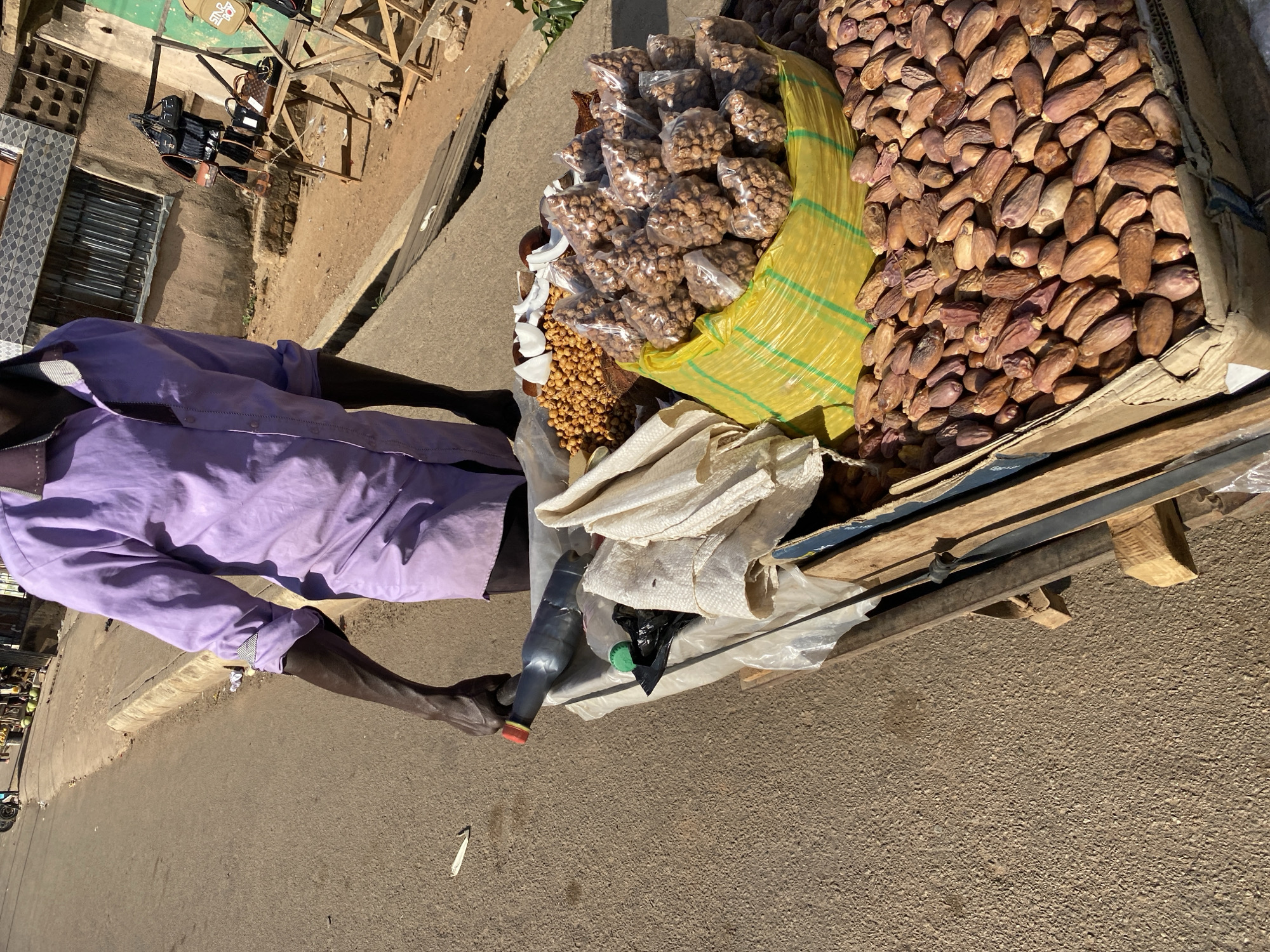 Street vendor sells goods from cart in Bukuru, Nigeria