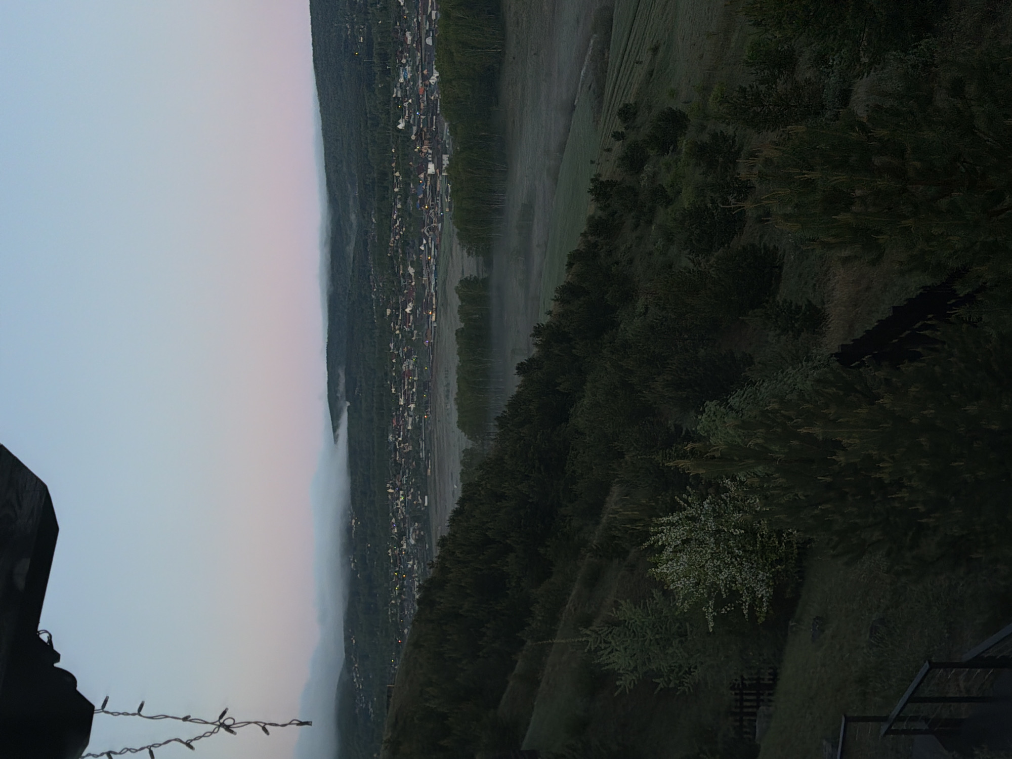 Fog blankets valley town in Shamoni, Russia