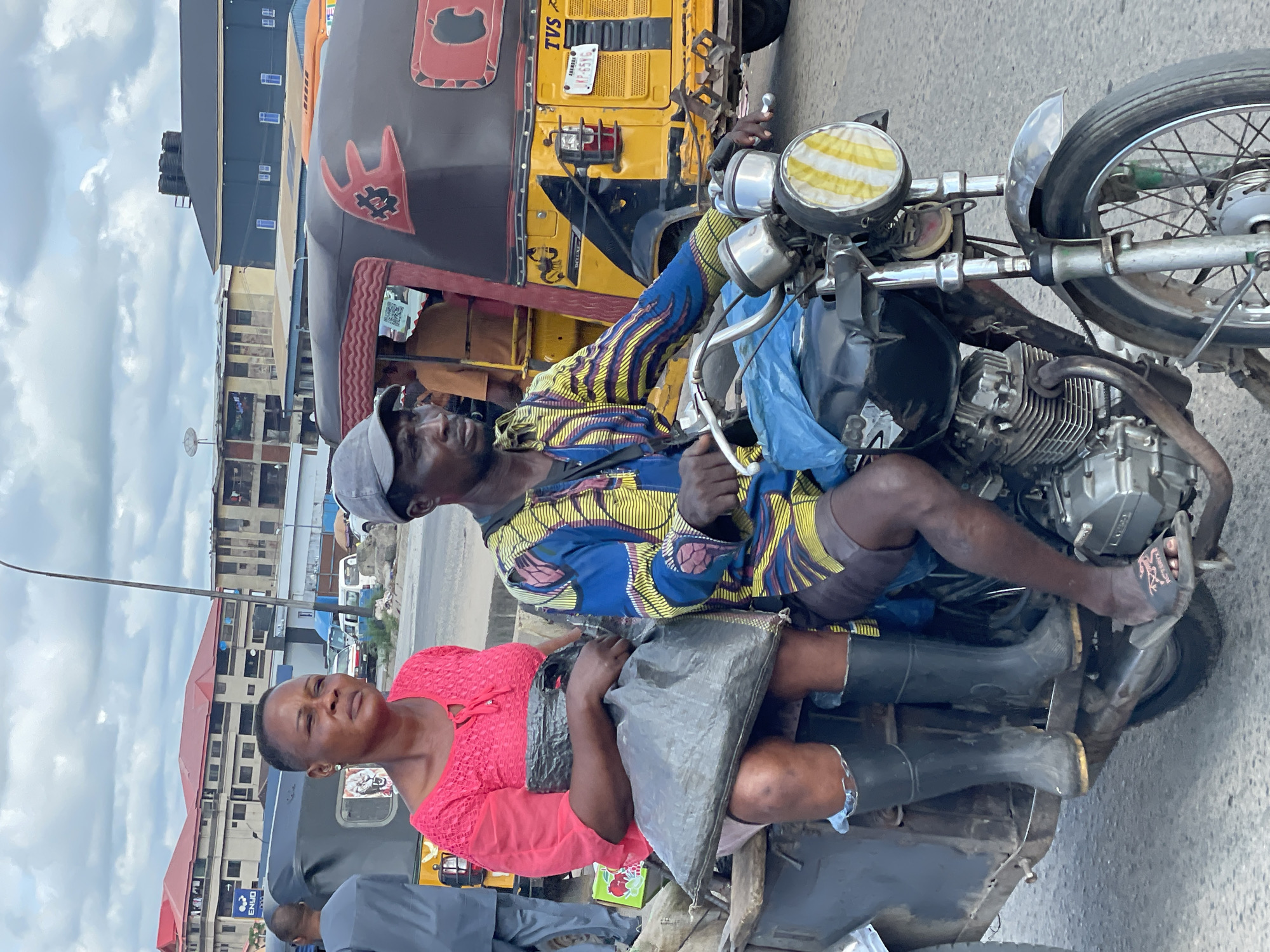 Morning street activity in Onitsha's busy market district
