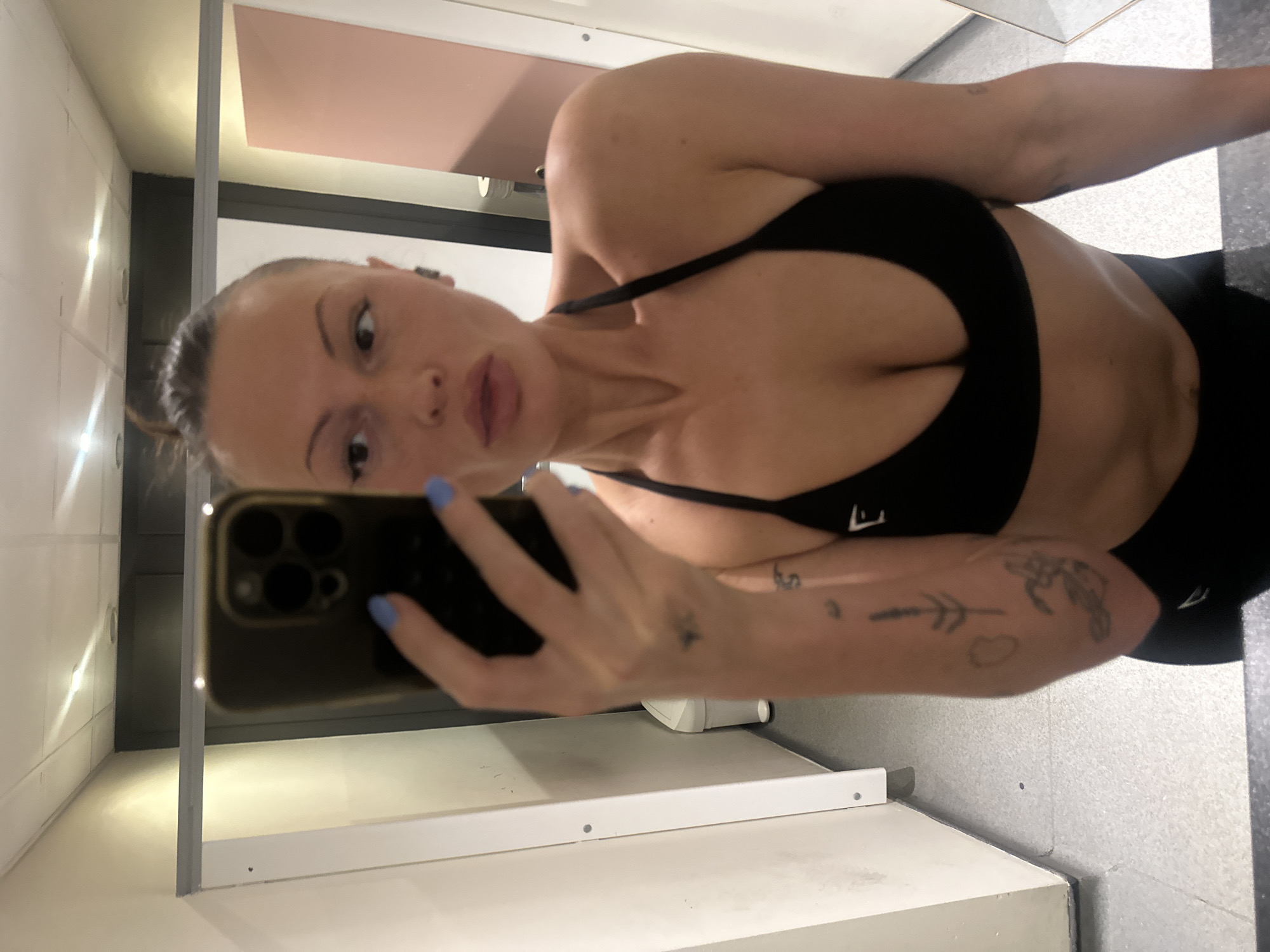 Woman takes mirror selfies in Tunbridge Wells public restroom