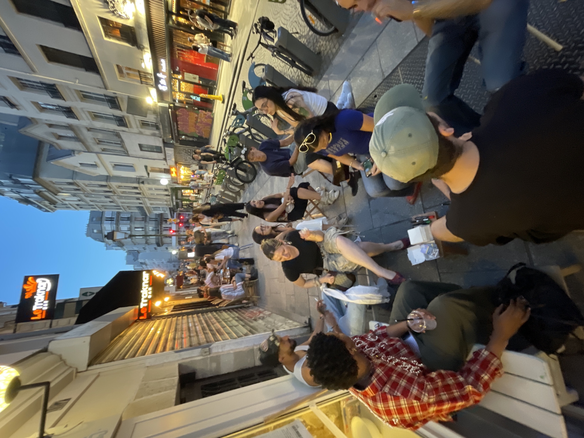 Evening social scenes captured across Paris bars and cafes