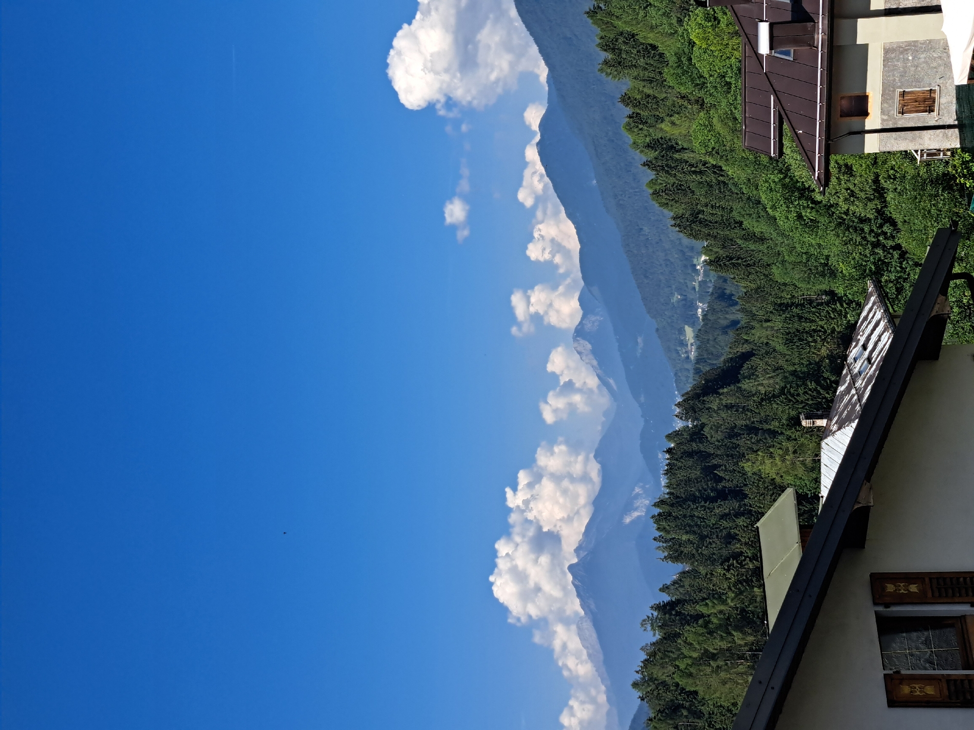 Alpine village morning: mountains, meadows, and old-town streets