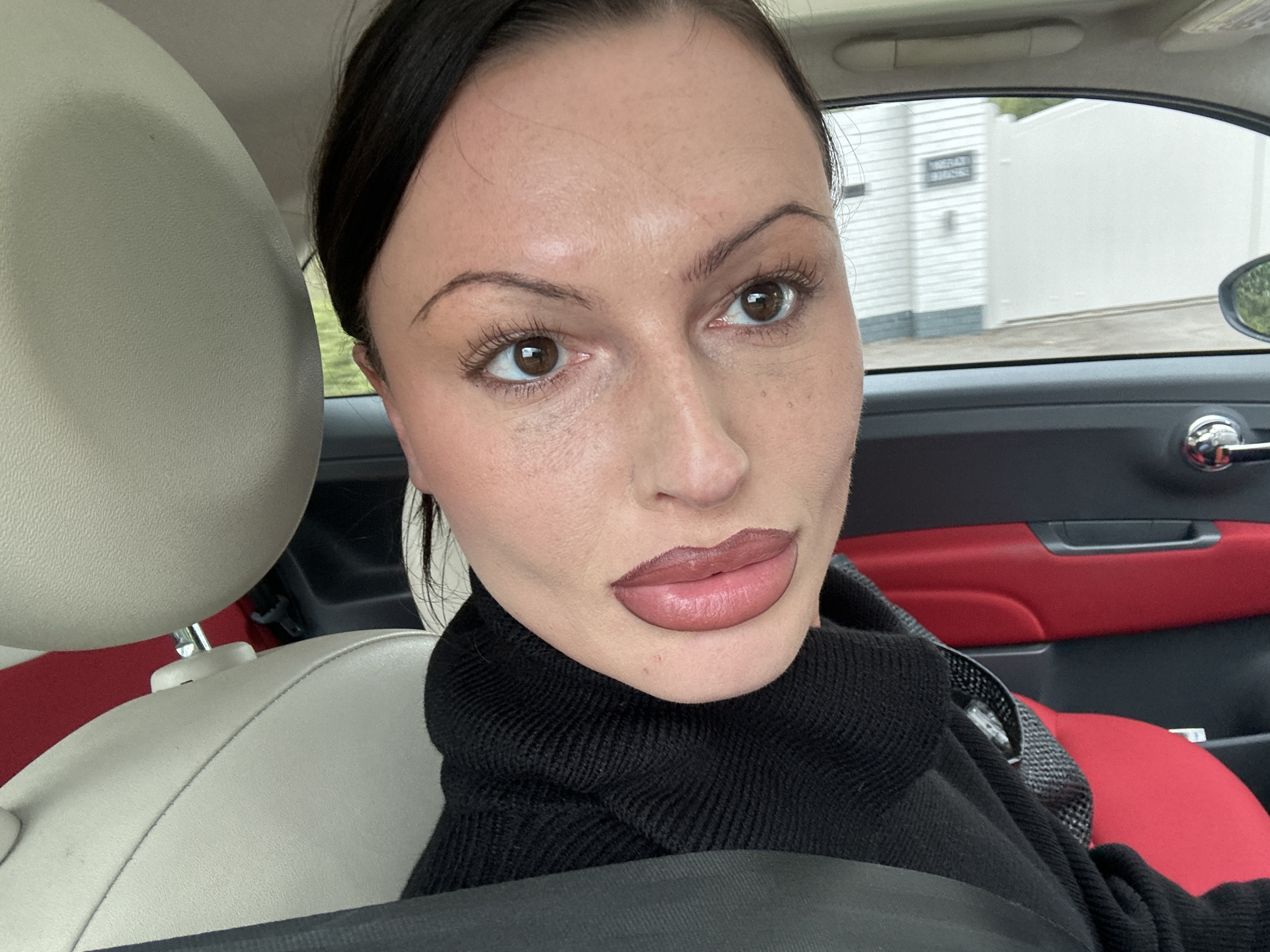 Woman documented in car and street locations in Wealden
