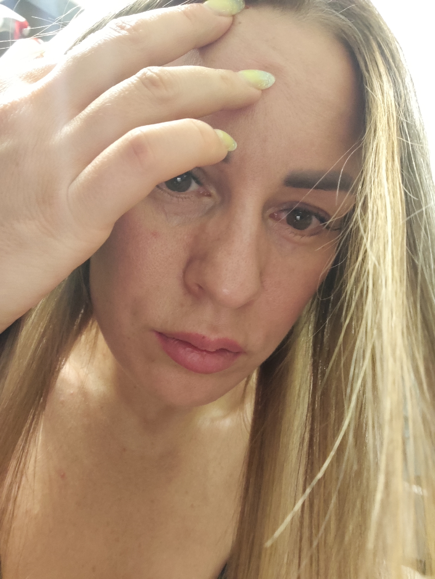 Close-up selfie series in Almaty, one showing eye irritation