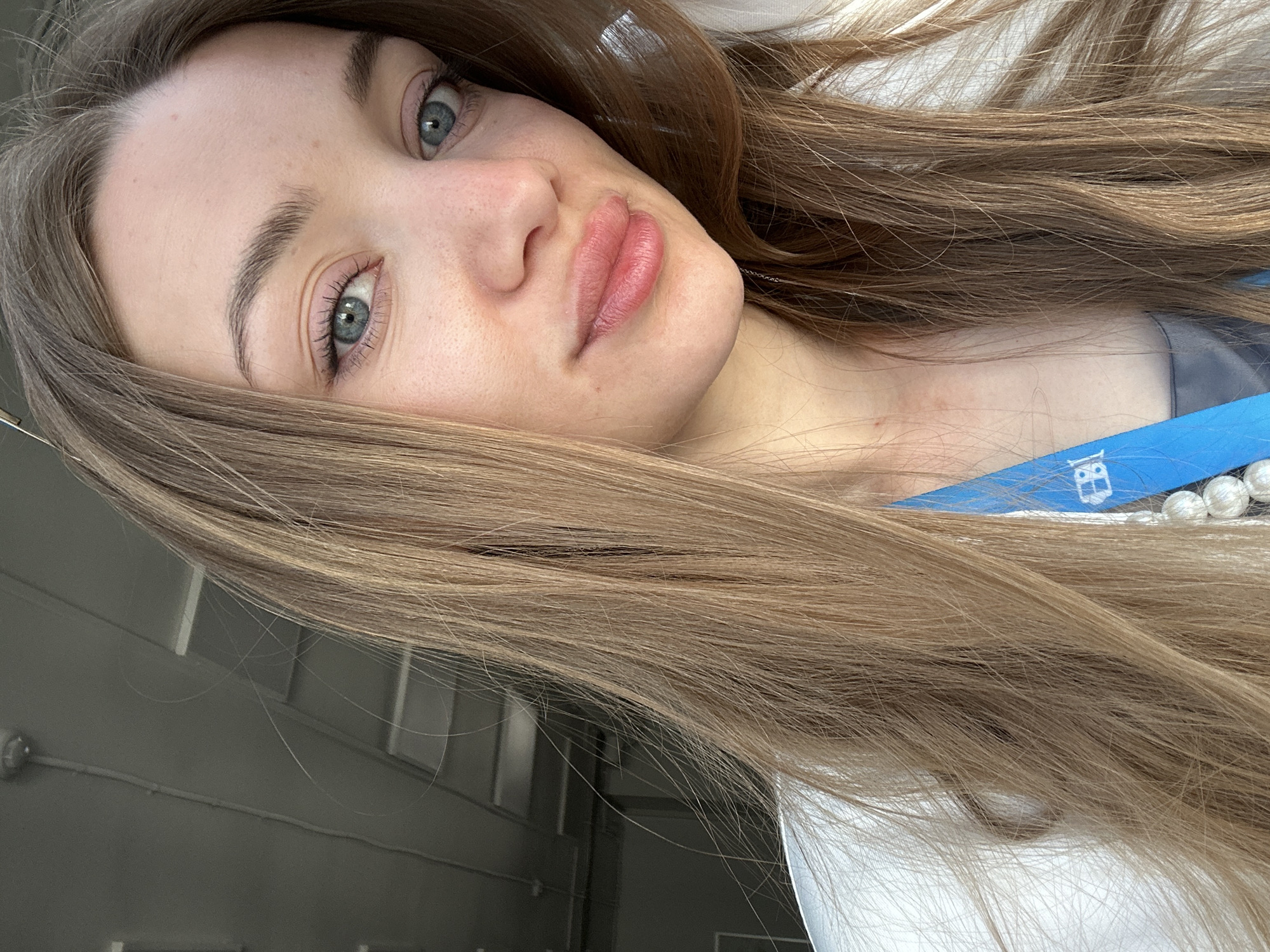 Woman photographed wearing lanyard in early morning Kazan selfie