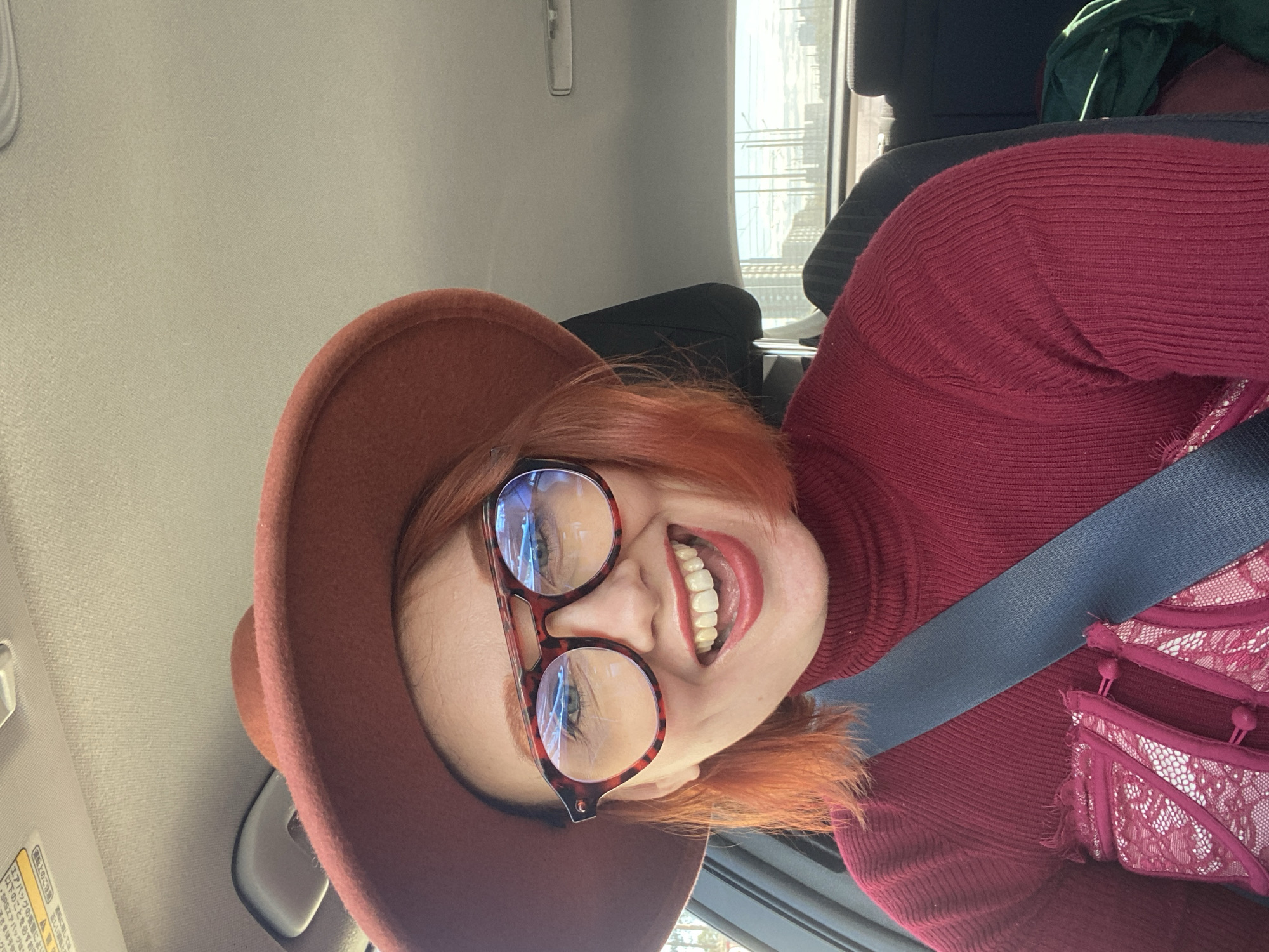 Red-haired individual takes car selfie in Yekaterinburg