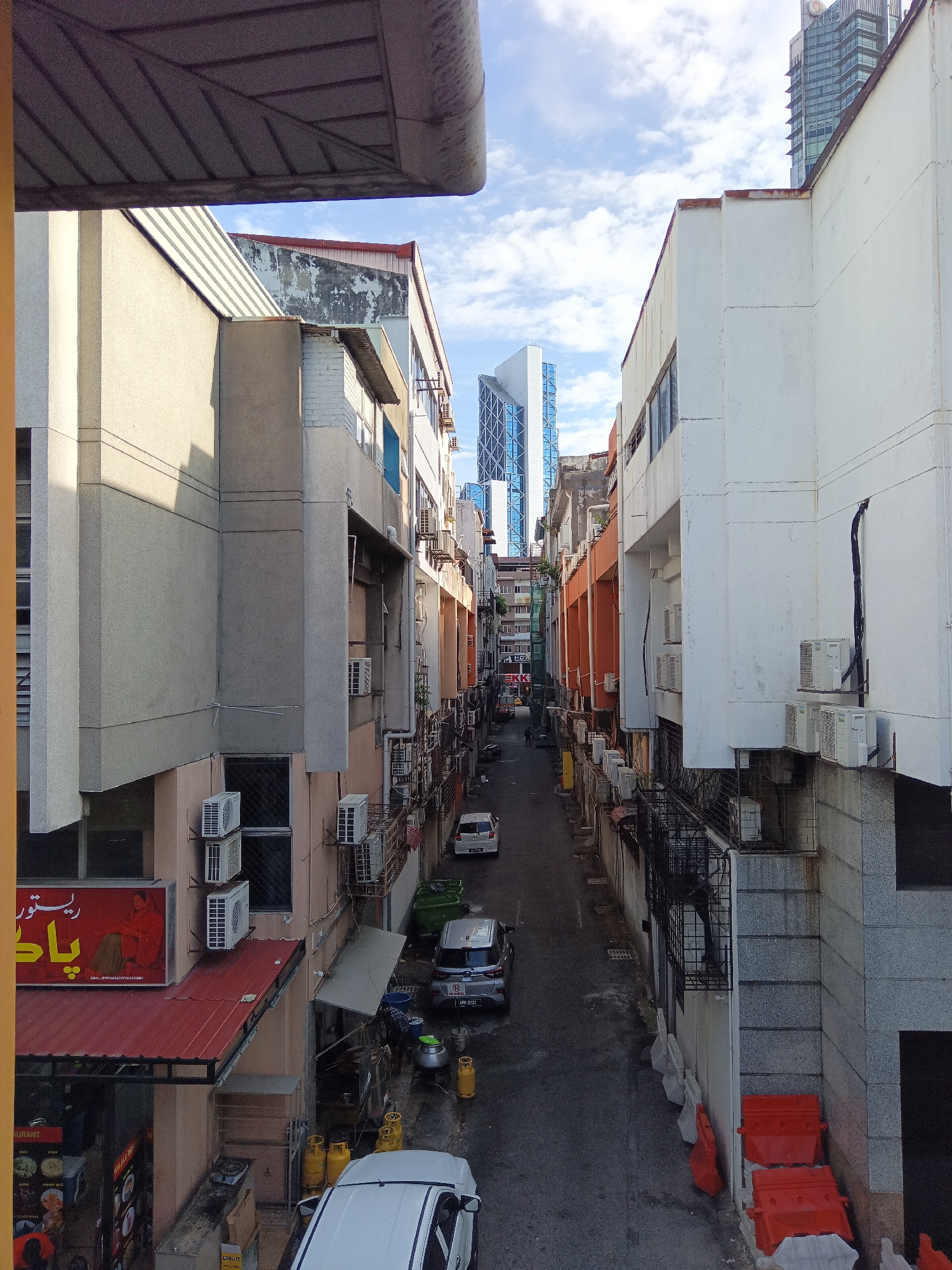 Pedestrians move through KL's elevated walkways on a weekday morning