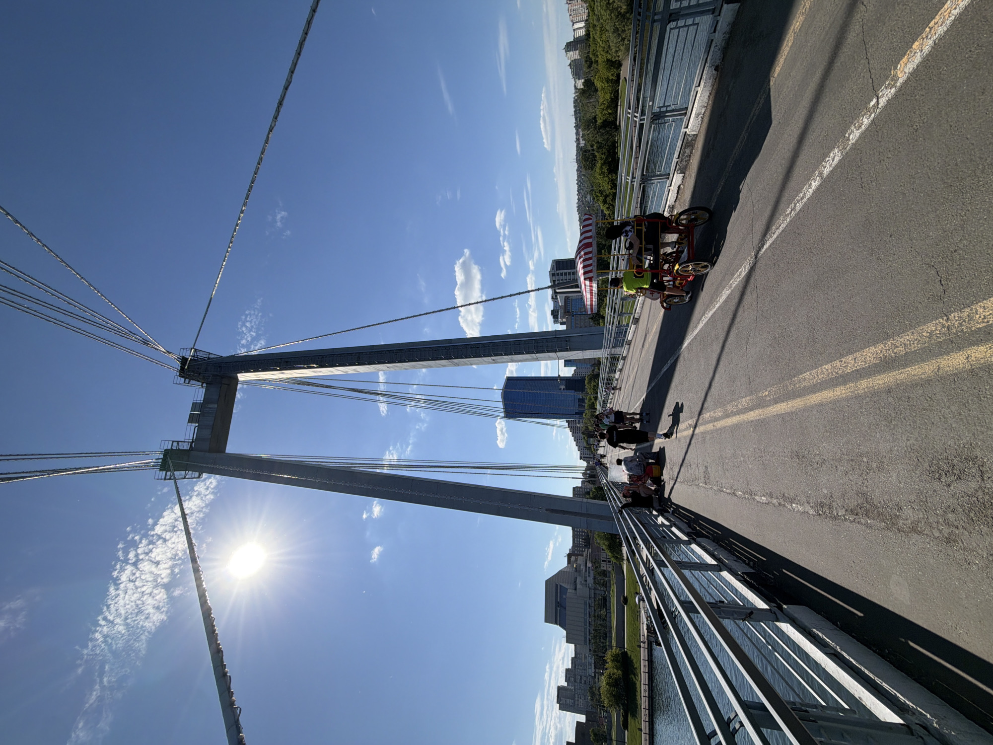Summer morning along Krasnoyarsk's Yenisei riverfront and pedestrian bridge