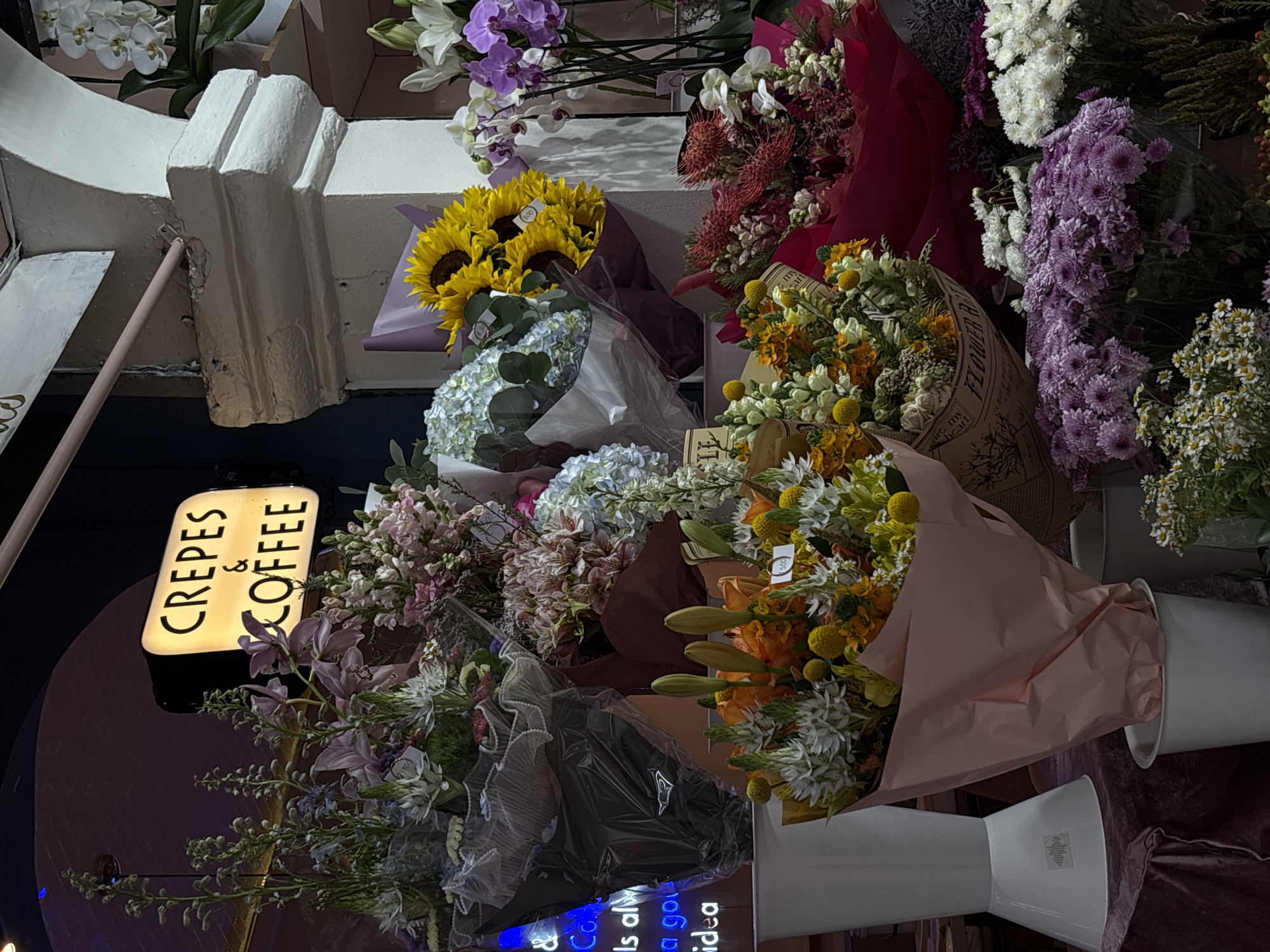 Evening observations capture flower shop display and pedestrian