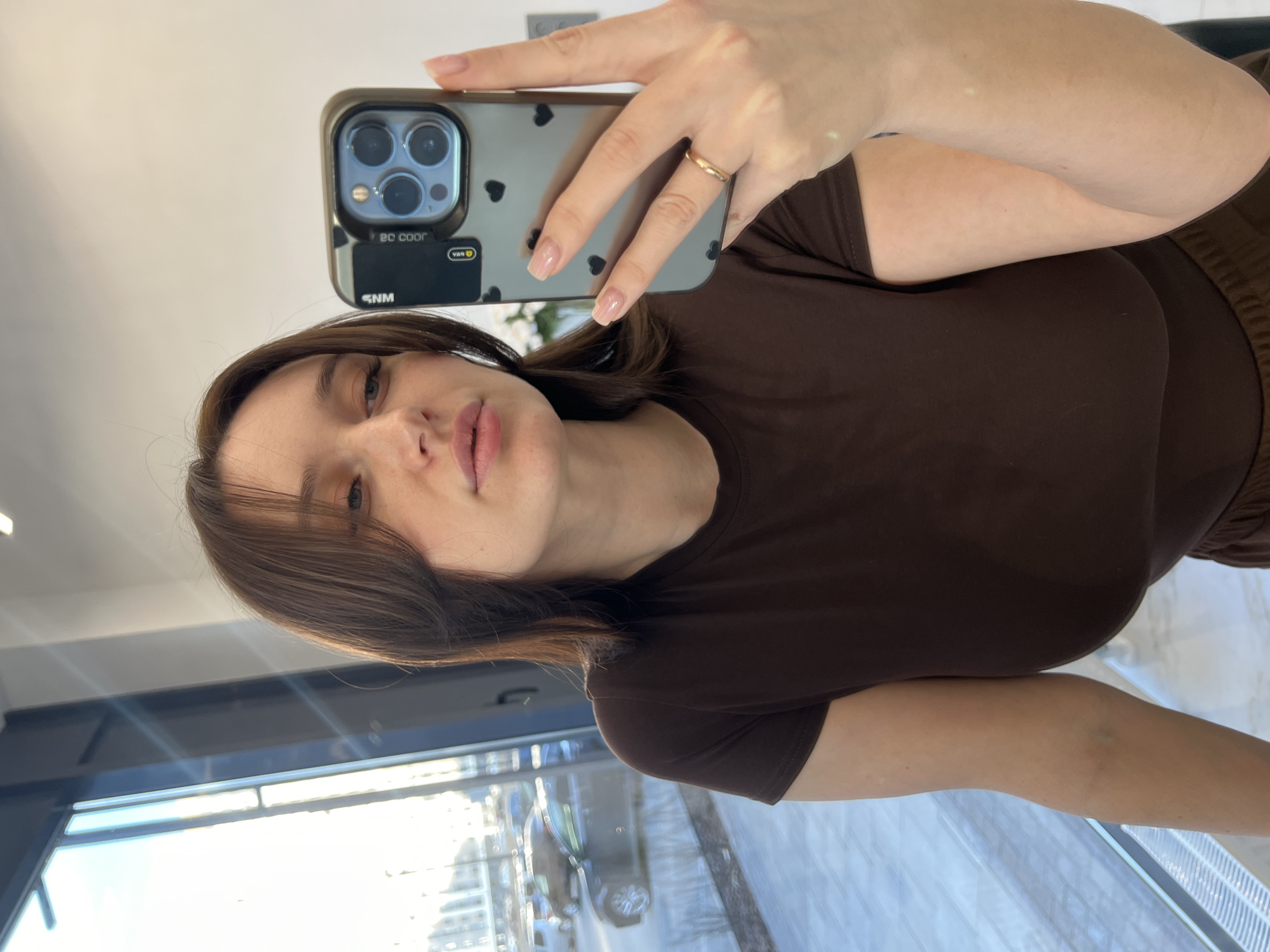 Woman takes selfies indoors in Tyumen, Russia