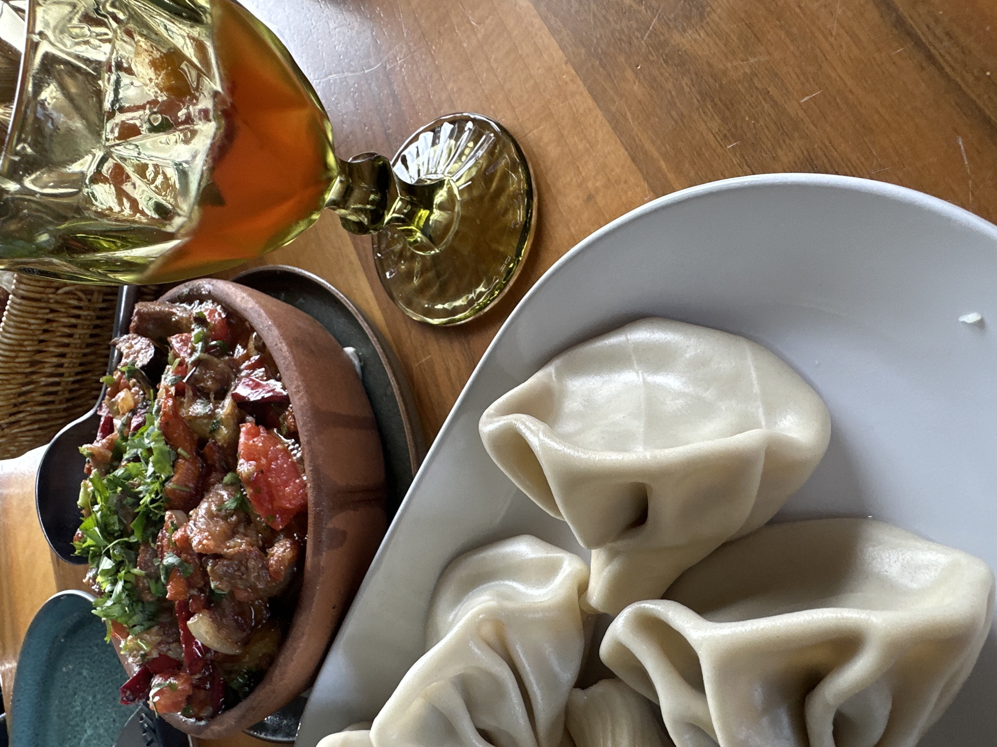 Woman documents traditional Georgian meal at Marneuli restaurant