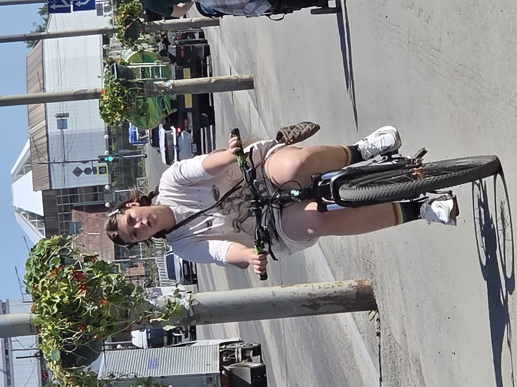 Everyday city life: cyclists, pedestrians, and street scenes on a sunny day