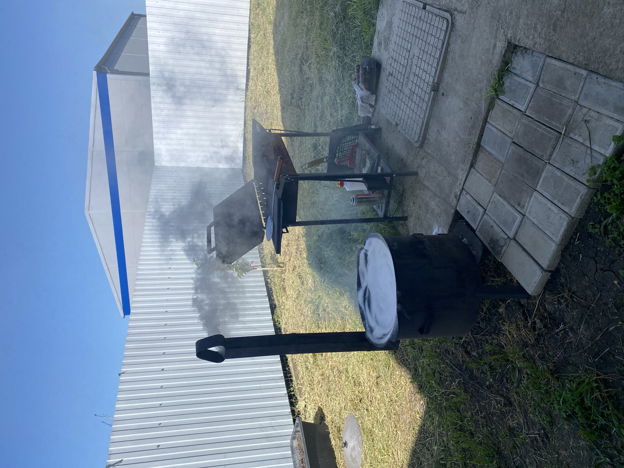 Barbecue smoker operates in outdoor setting in Industrialny, Russia