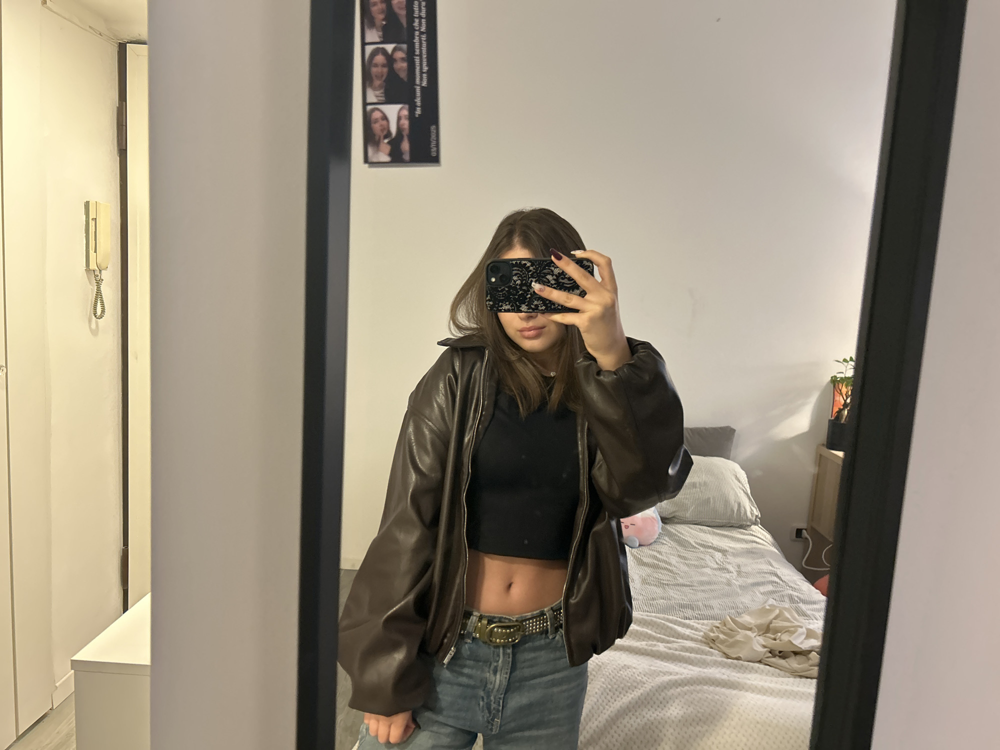 Woman takes morning selfie in Milan bedroom
