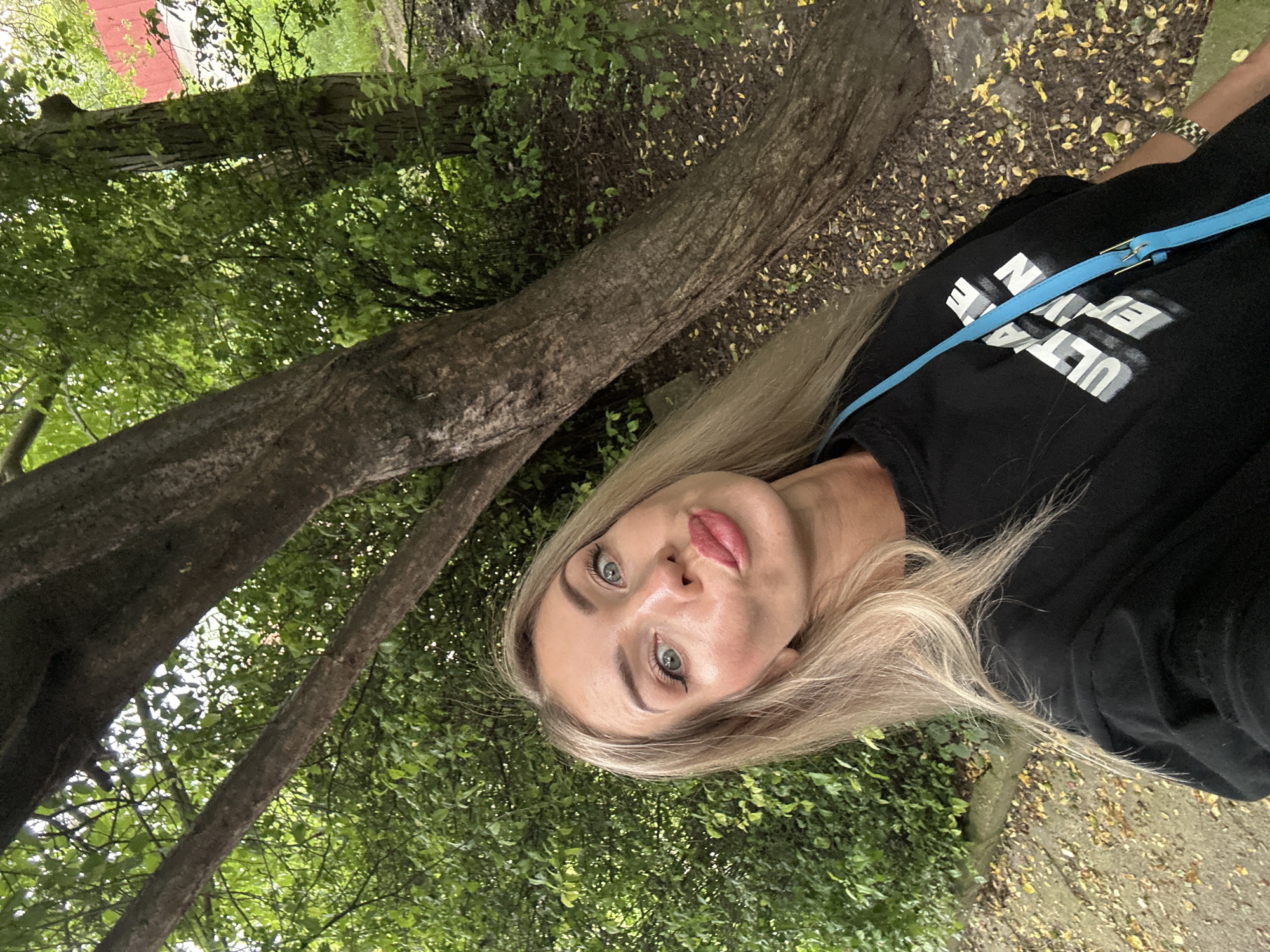 Woman documents afternoon dog walk with selfies in Armavir