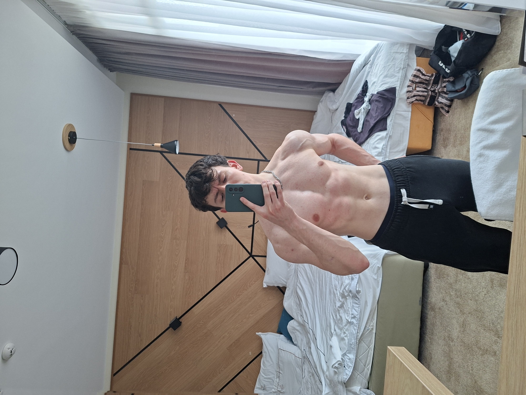 Young man takes fitness selfies in Pavel Banya hotel